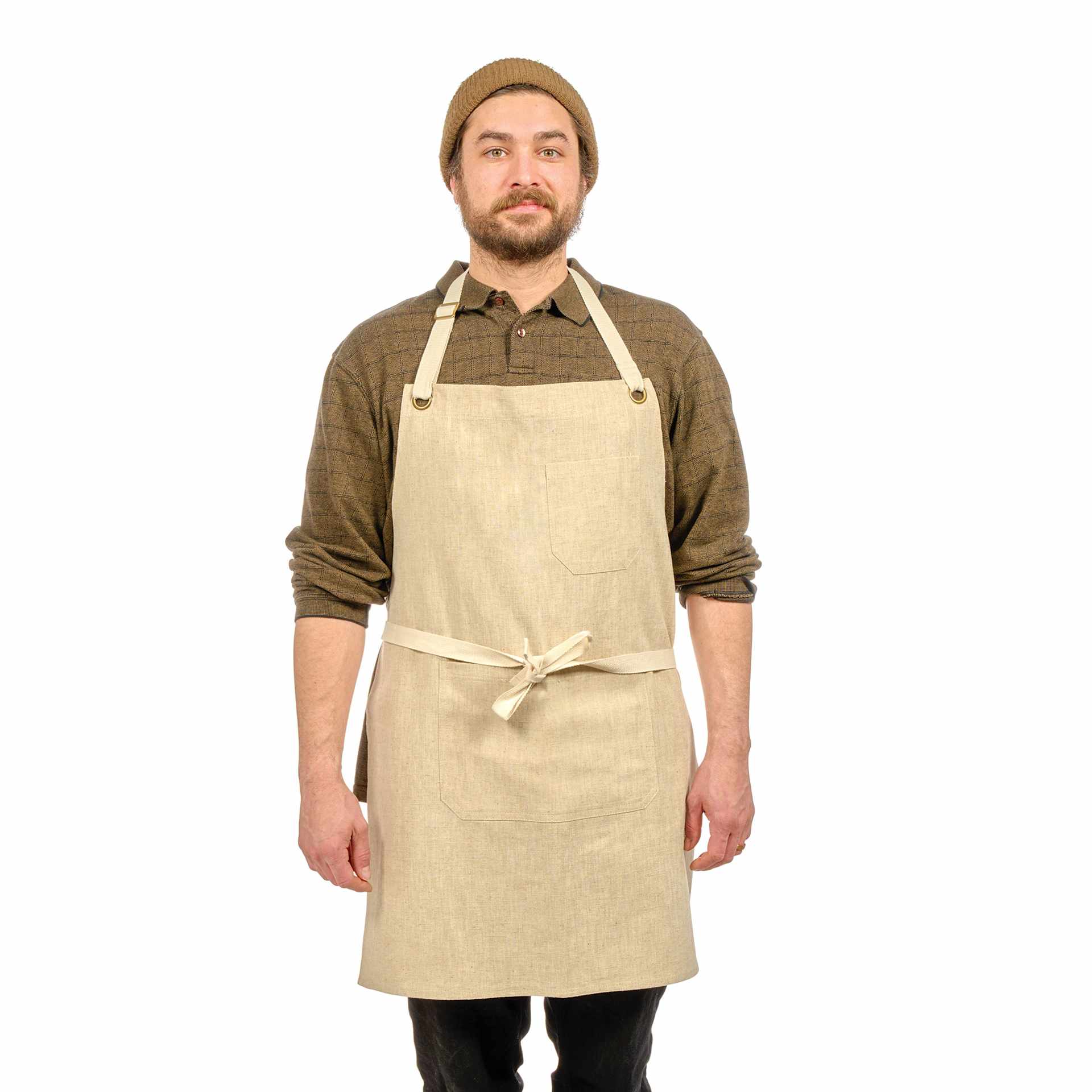 Front view of Blick Artisan Apron - Oatmeal on a person