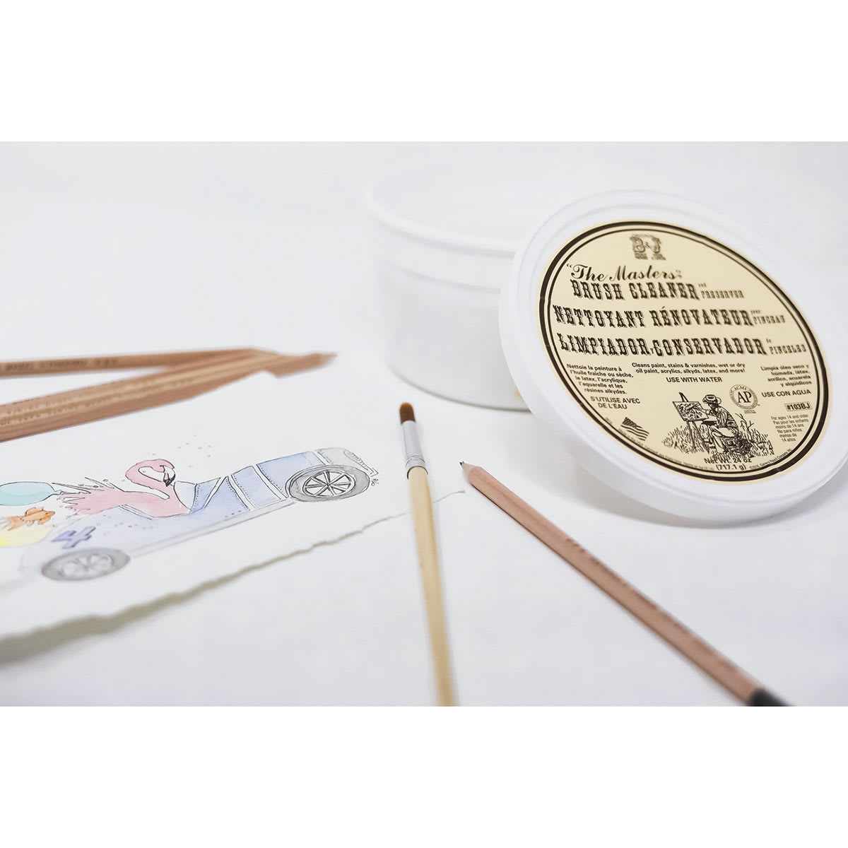 The Masters Brush Cleaner and Preserver - Classroom Tub beside artwork, pencil, and brush.