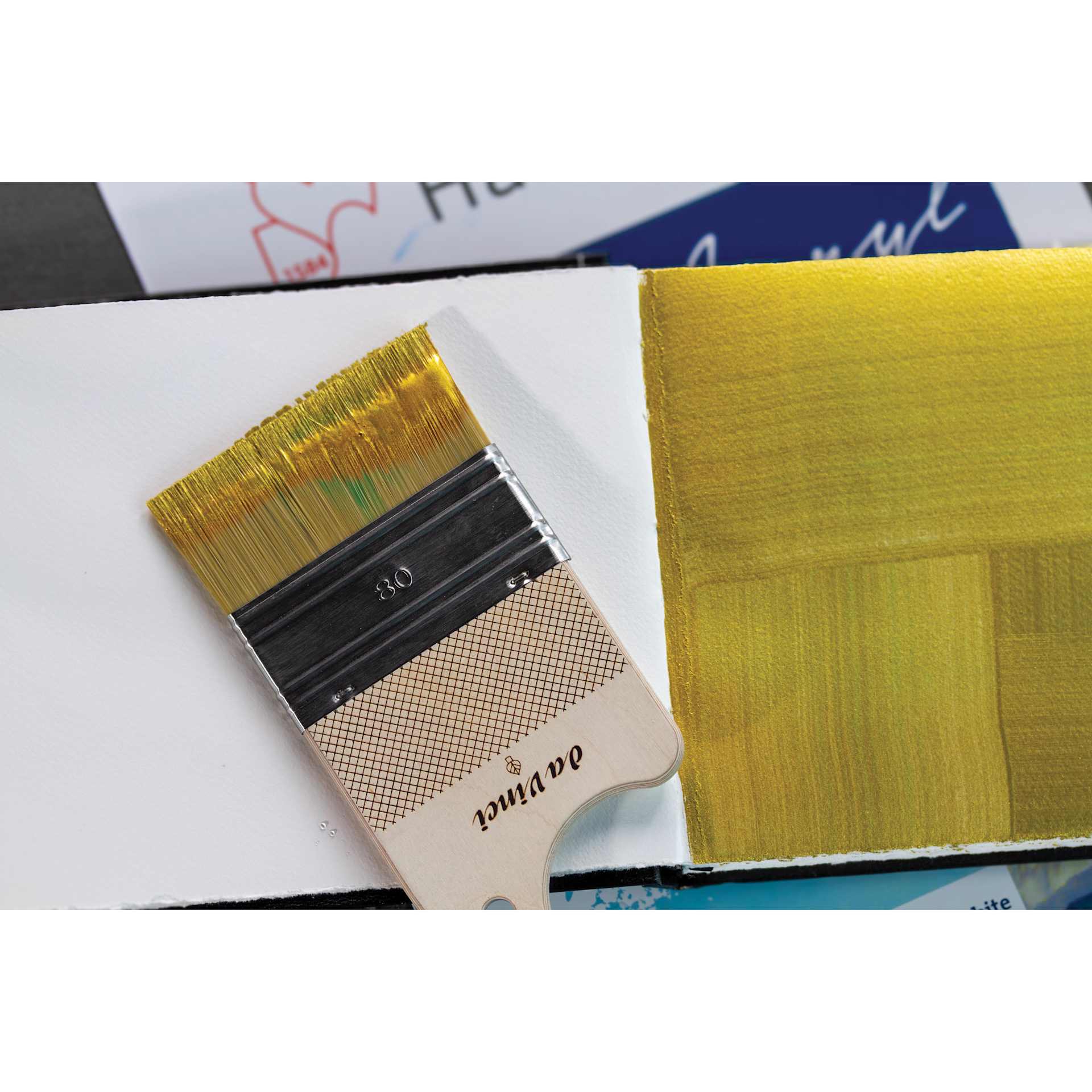 Da Vinci Synthetic Hog Bristle Paddle Brush next to painting