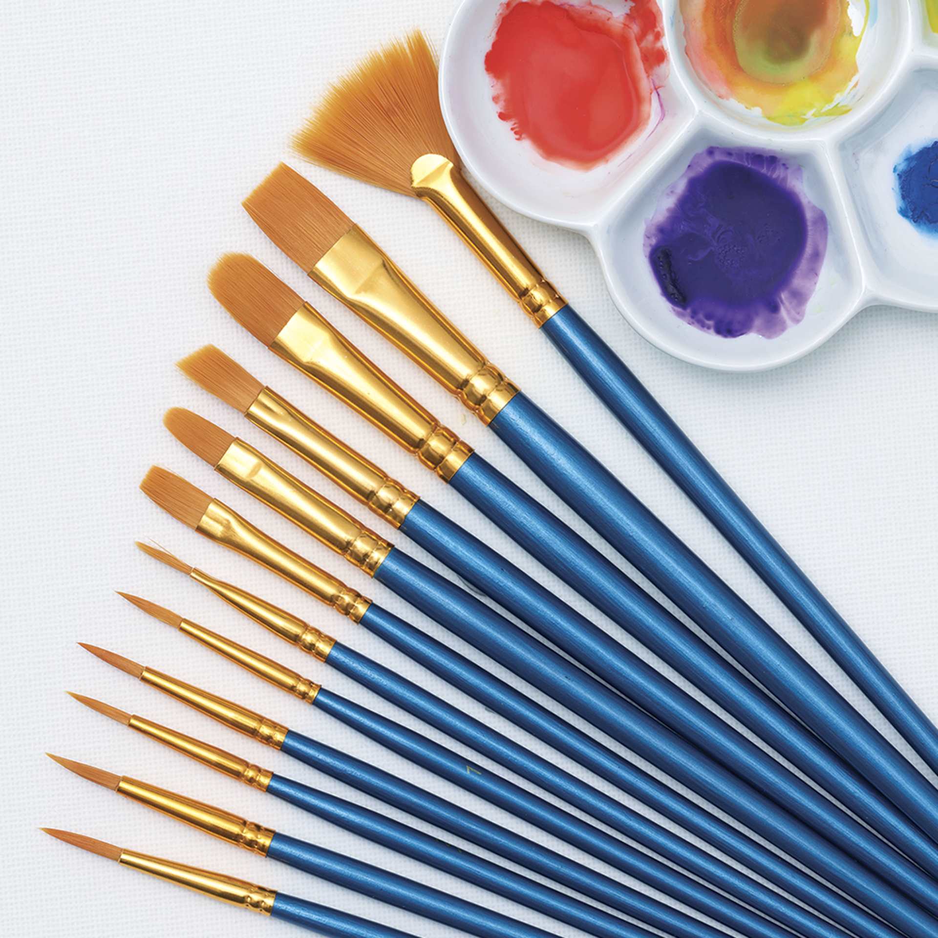 Blick Super Value Golden Taklon 120 Count Brush Set - Assorted Brushes fanned out with palette