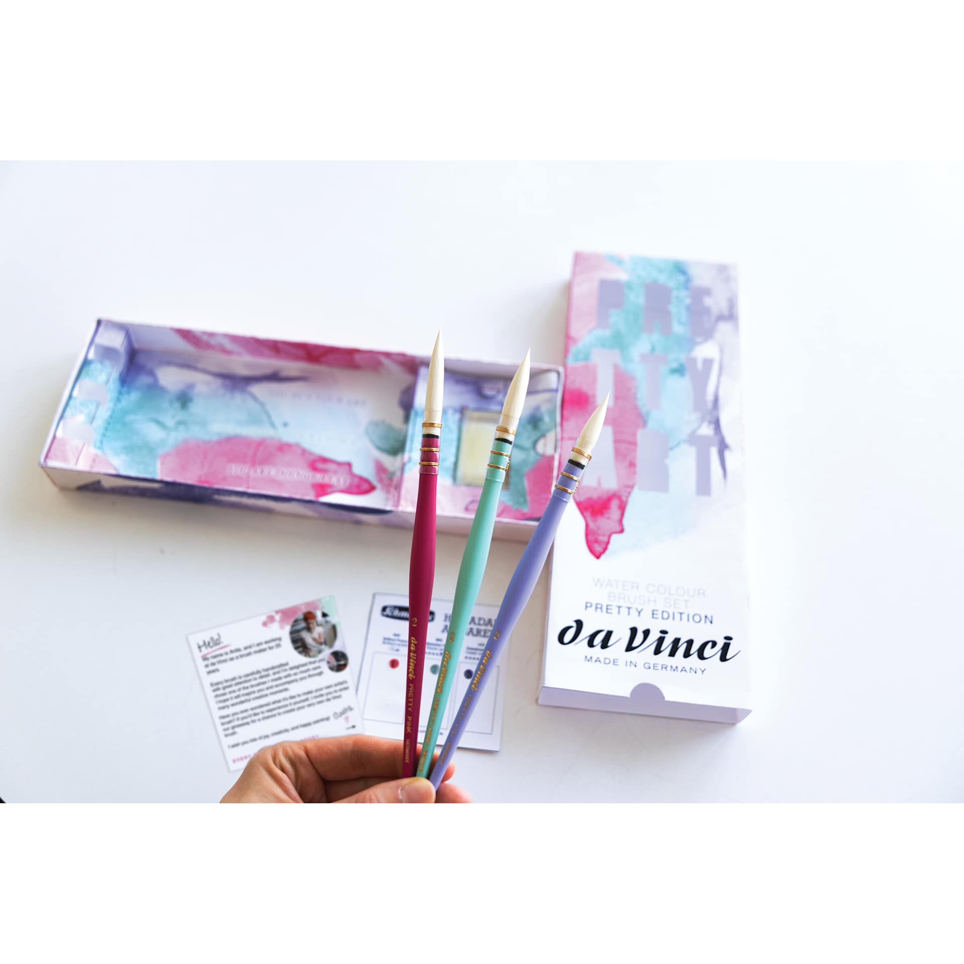 Da Vinci Pretty Art Brush Set, open packaging showing dot card, brush soap, and three brushes being held