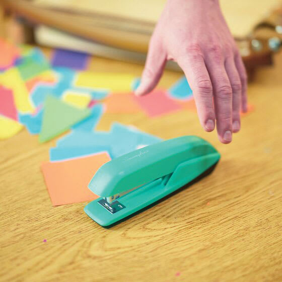 Swingline 545 Standard Stapler - Spring Green sitting on table