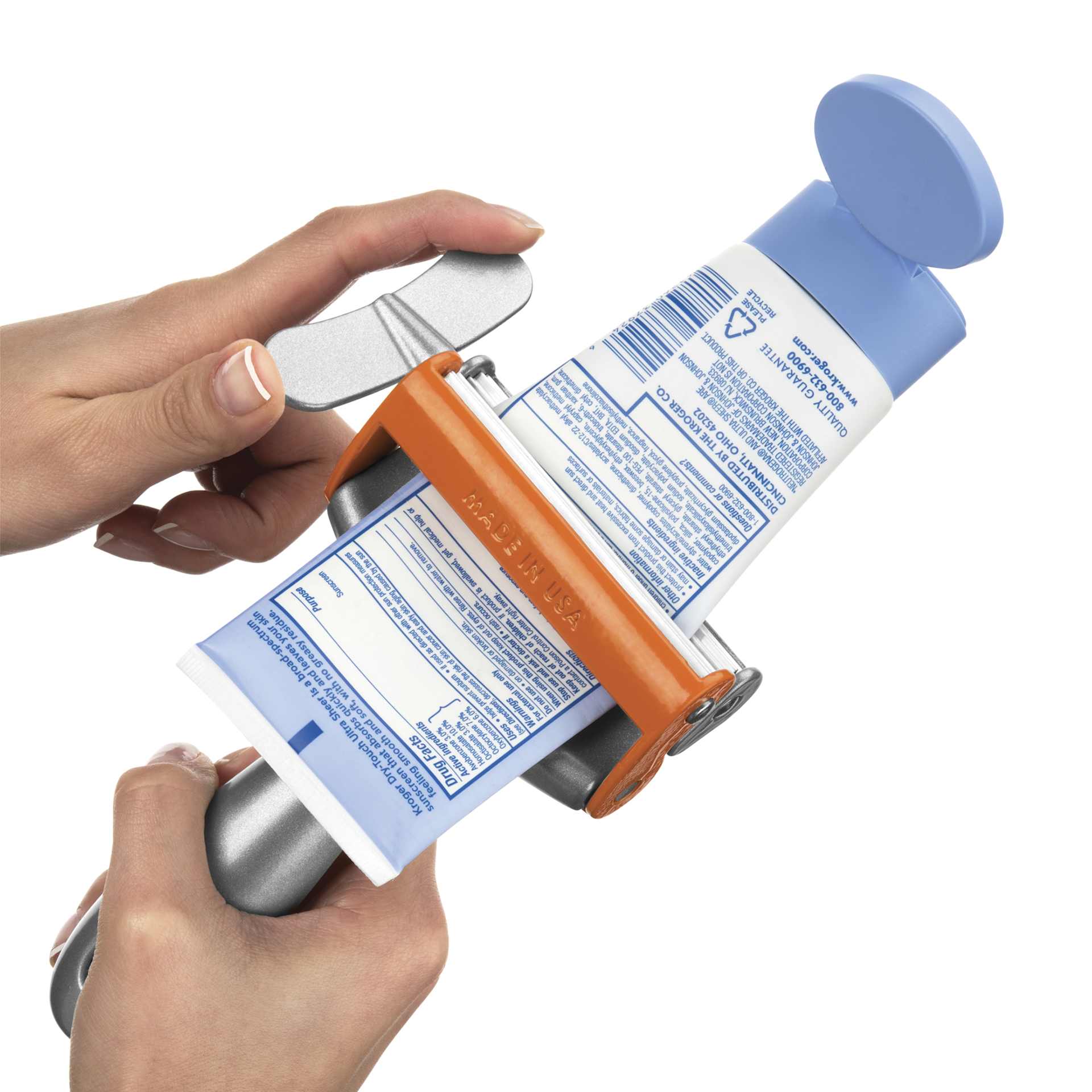 Tube Squeezer by Big Squeeze - Orange, wringing a tube