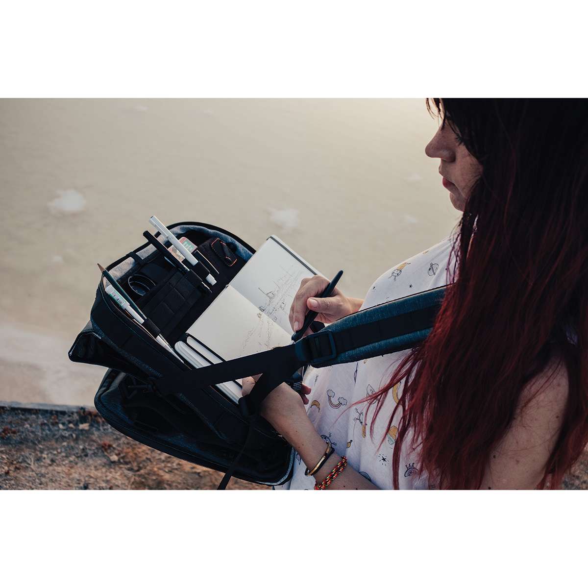 Etchr Art Satchel being used as a drawing surface.