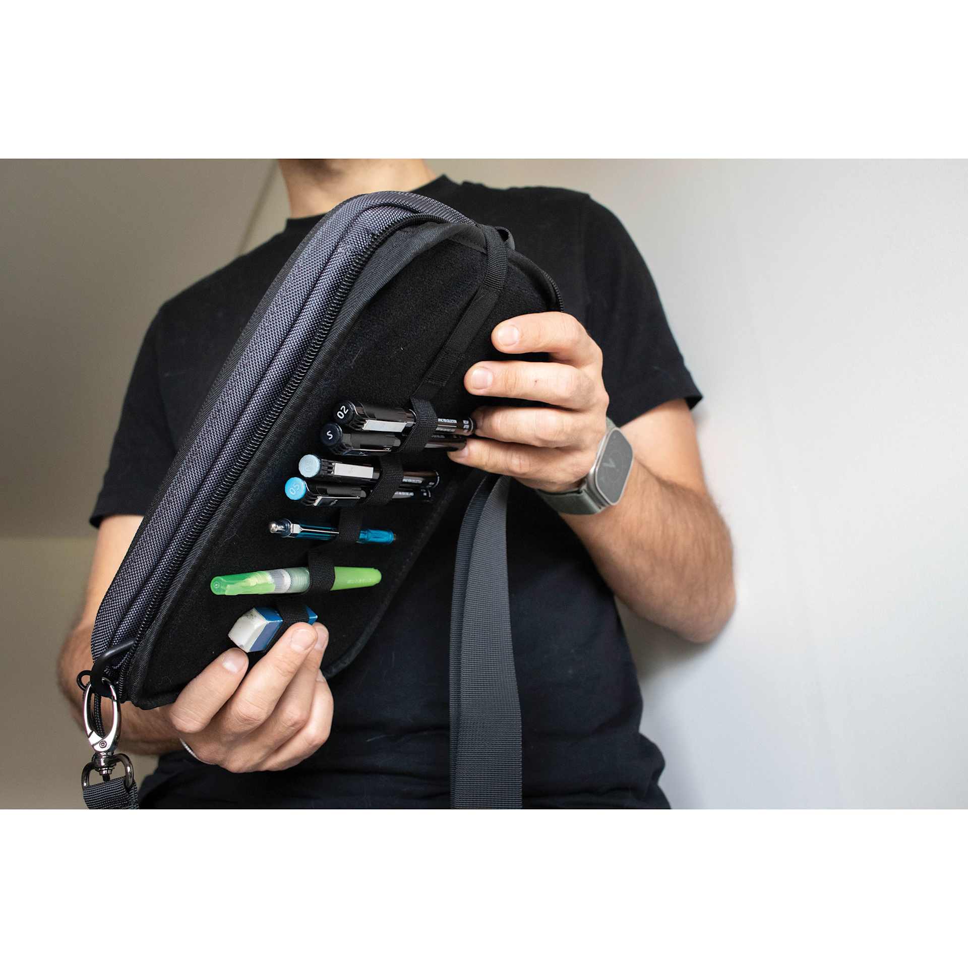 Etchr Nano Satchel - Grey, showing drawing tools inside pencil slots (drawing supplies not included)