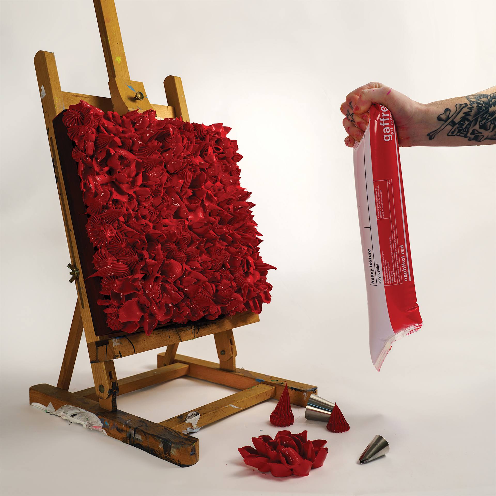 Gaffrey Heavy Body Texture Acrylic Paint - Naphthol Red used to paint dimensional roses on canvas