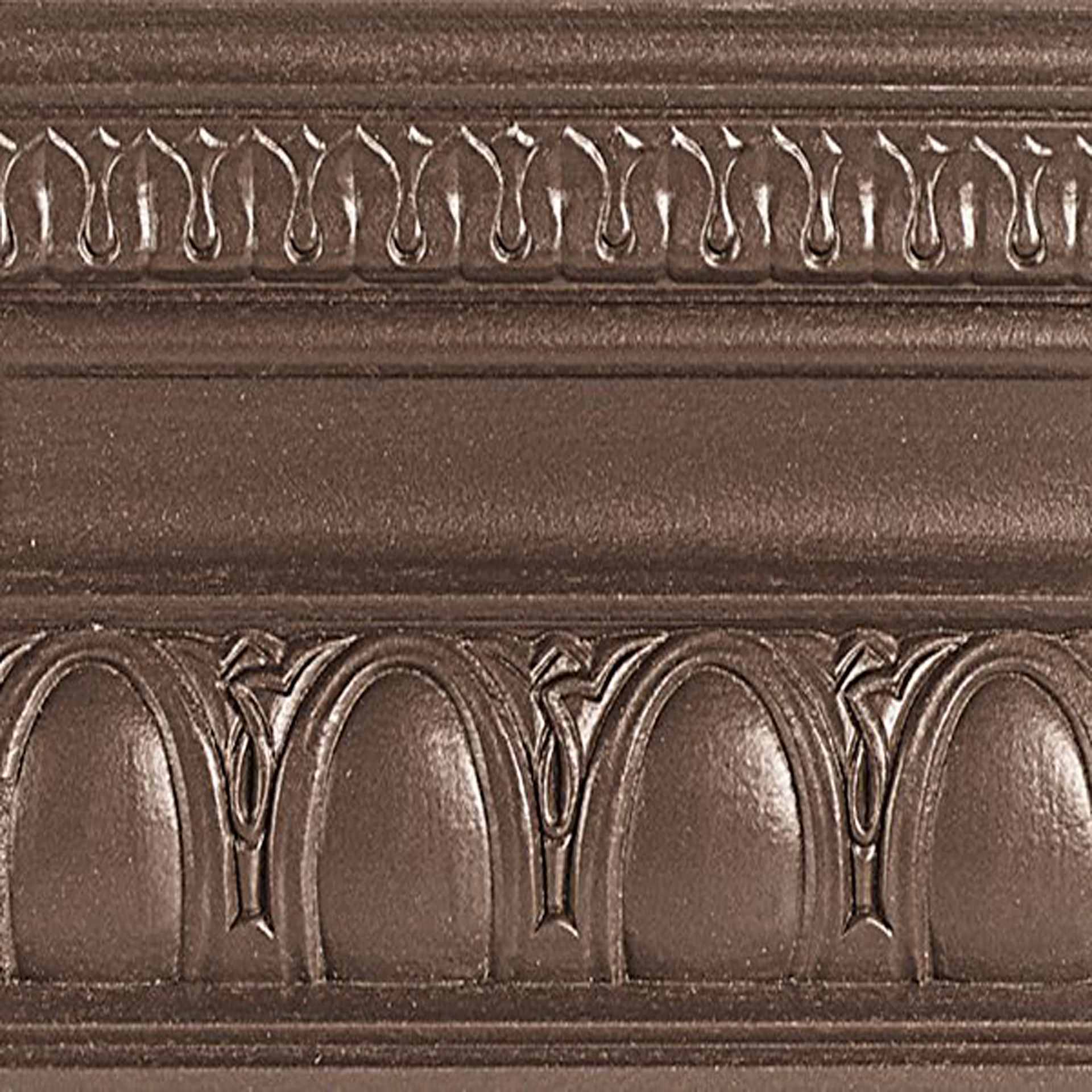 Modern Masters Metallic Paint - Statuary Bronze painted on a piece of trim