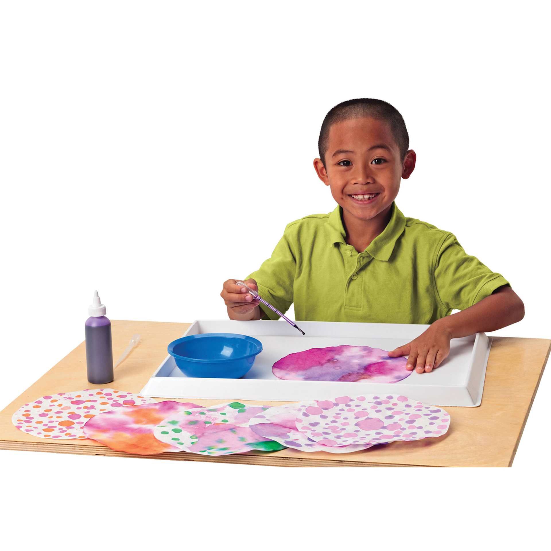 Roylco Color Diffusing Paper - Child using watercolor and a paintbrush to paint the Diffusing Paper