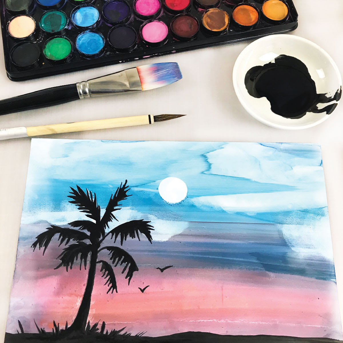 Watercolor painting of palm tree and sunset using Yasutomo Mineral Paper Artist Paper.