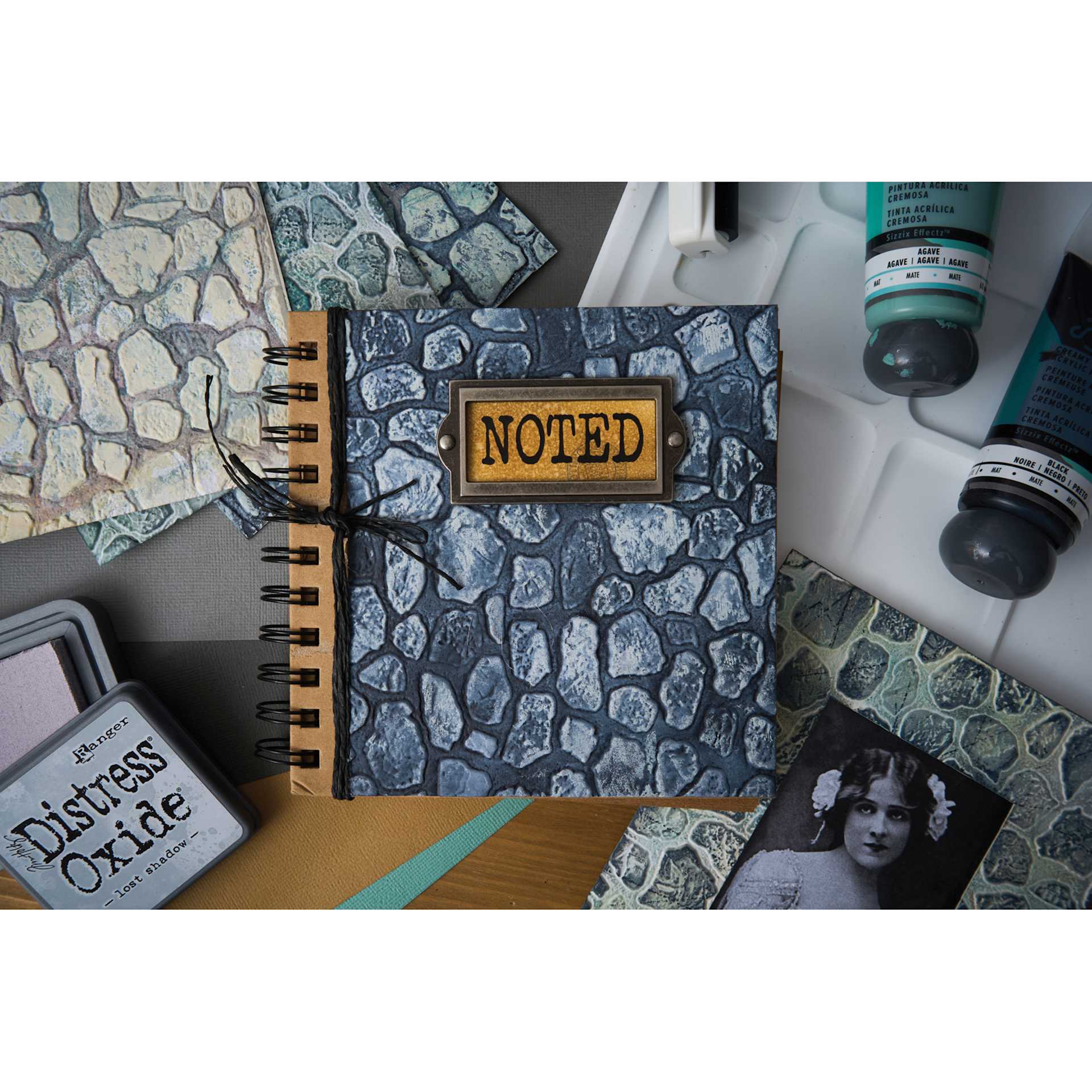 Sizzix 3-D Texture Fades Embossing Folder - Cobblestone applied to cover of notebook