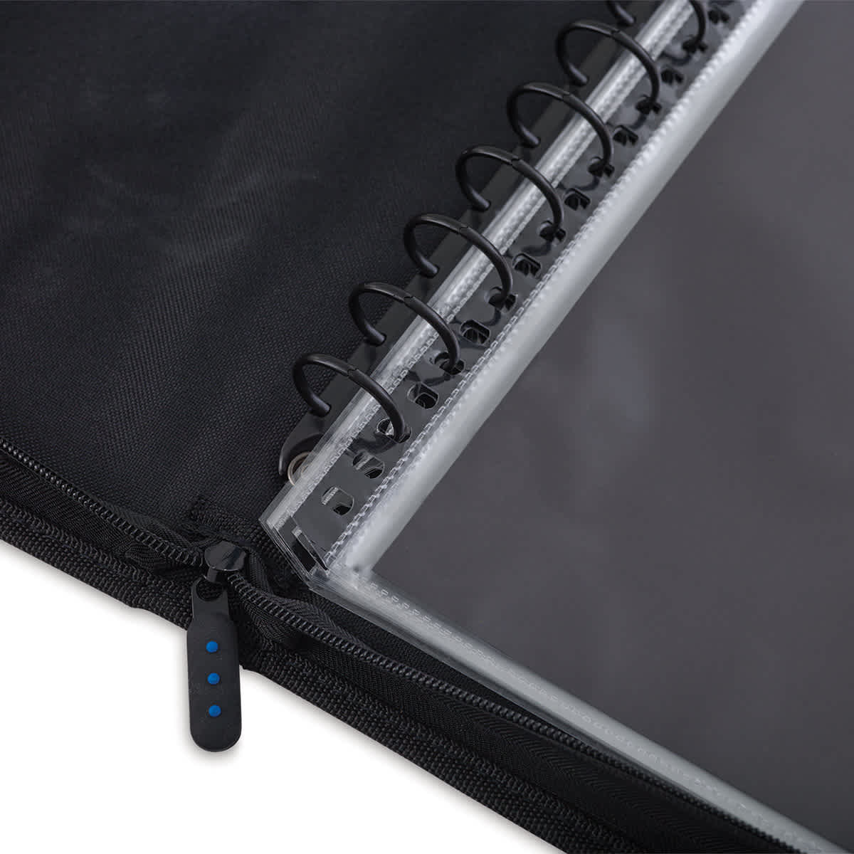 Close-up of multi-ring binding and zipper 