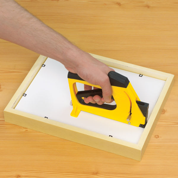 MultiMaster Framer's Point Driver - Artist driving points into back of frame with Point Driver