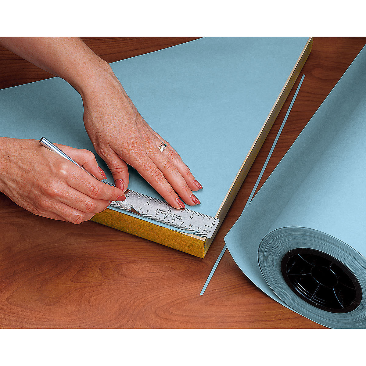 Lineco Backing Paper being applied to the back of a frame