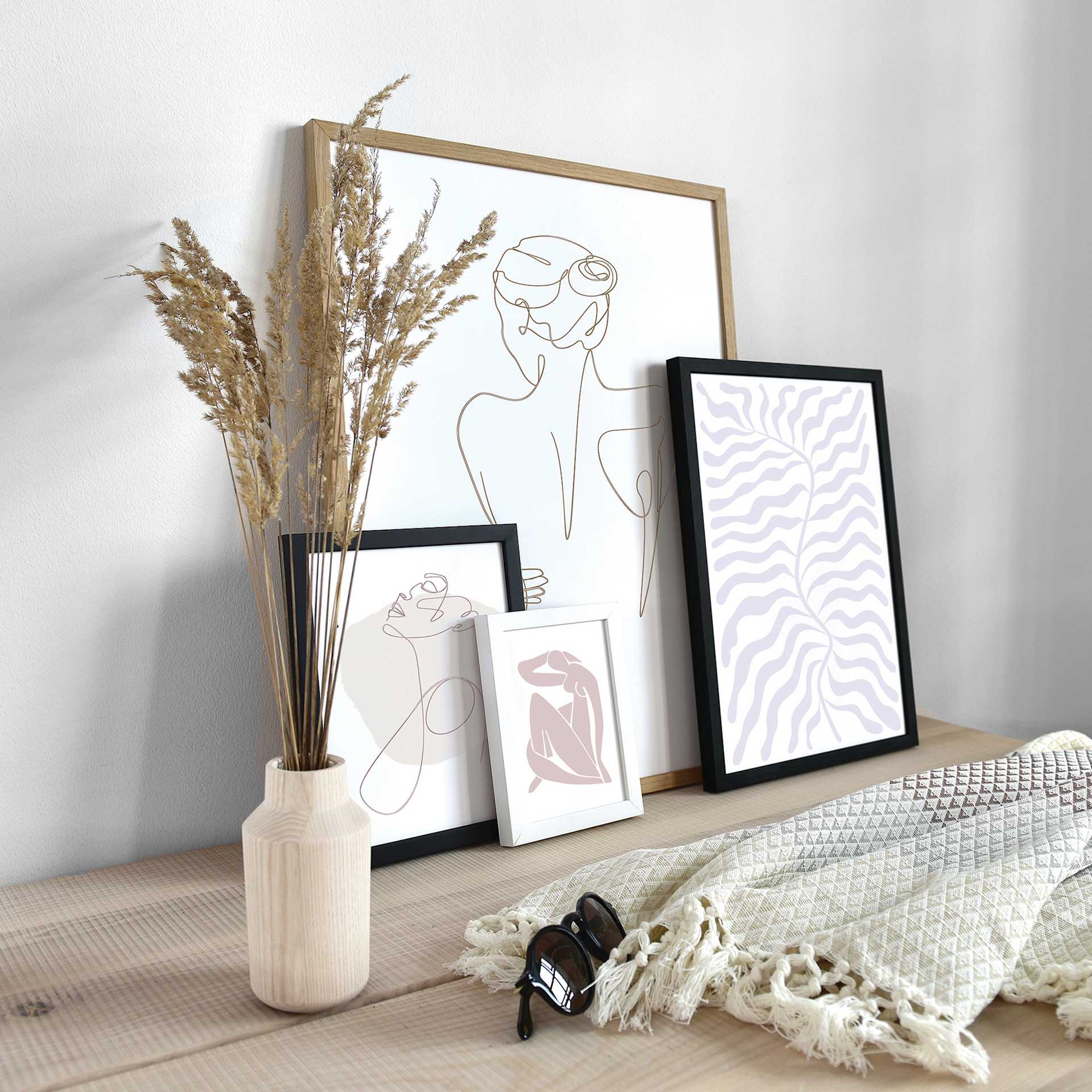 White, Black, and Natural Oak Deha Design Fontana Frames displayed on table.