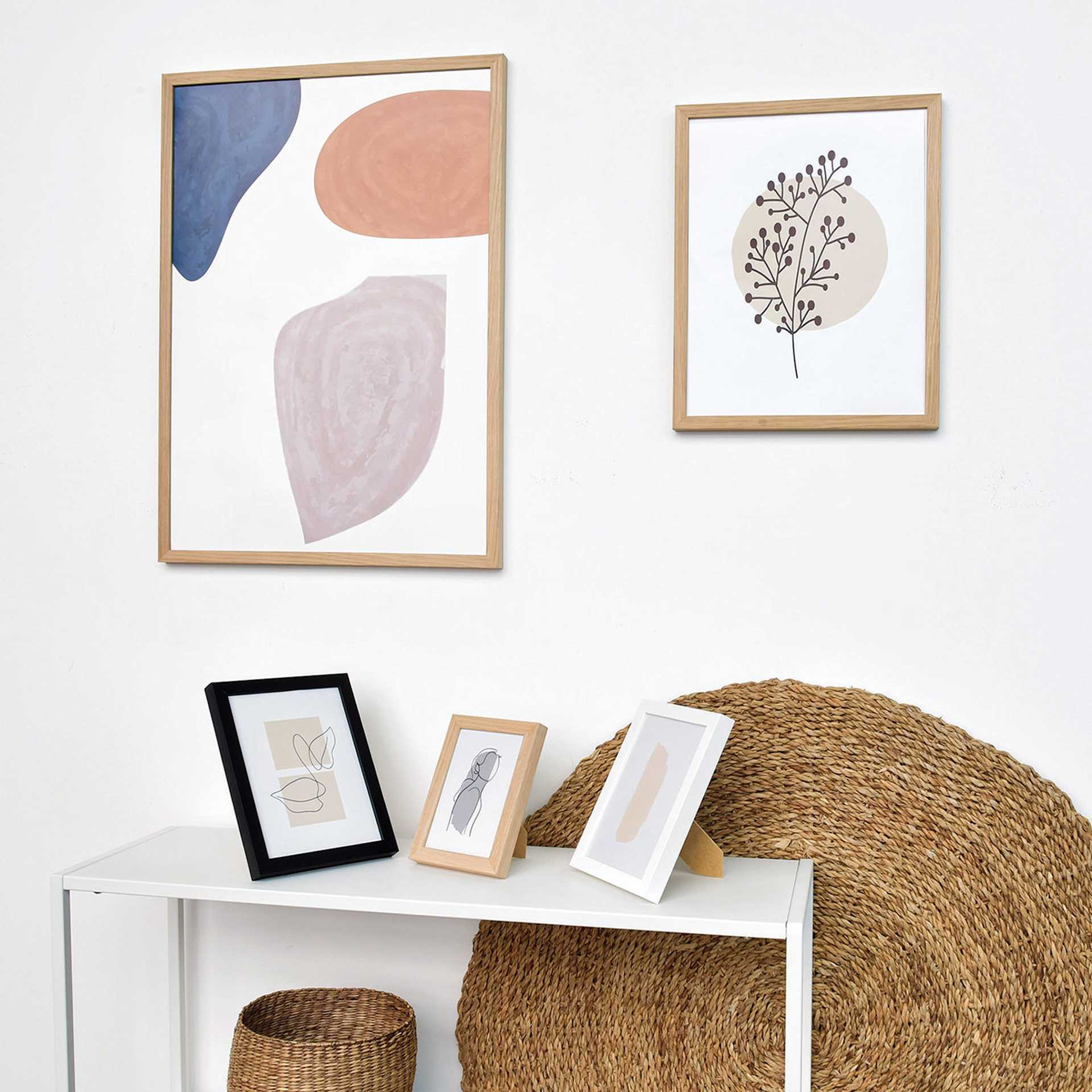 A selection of Deha Design Fontana Frames hung and displayed on a table