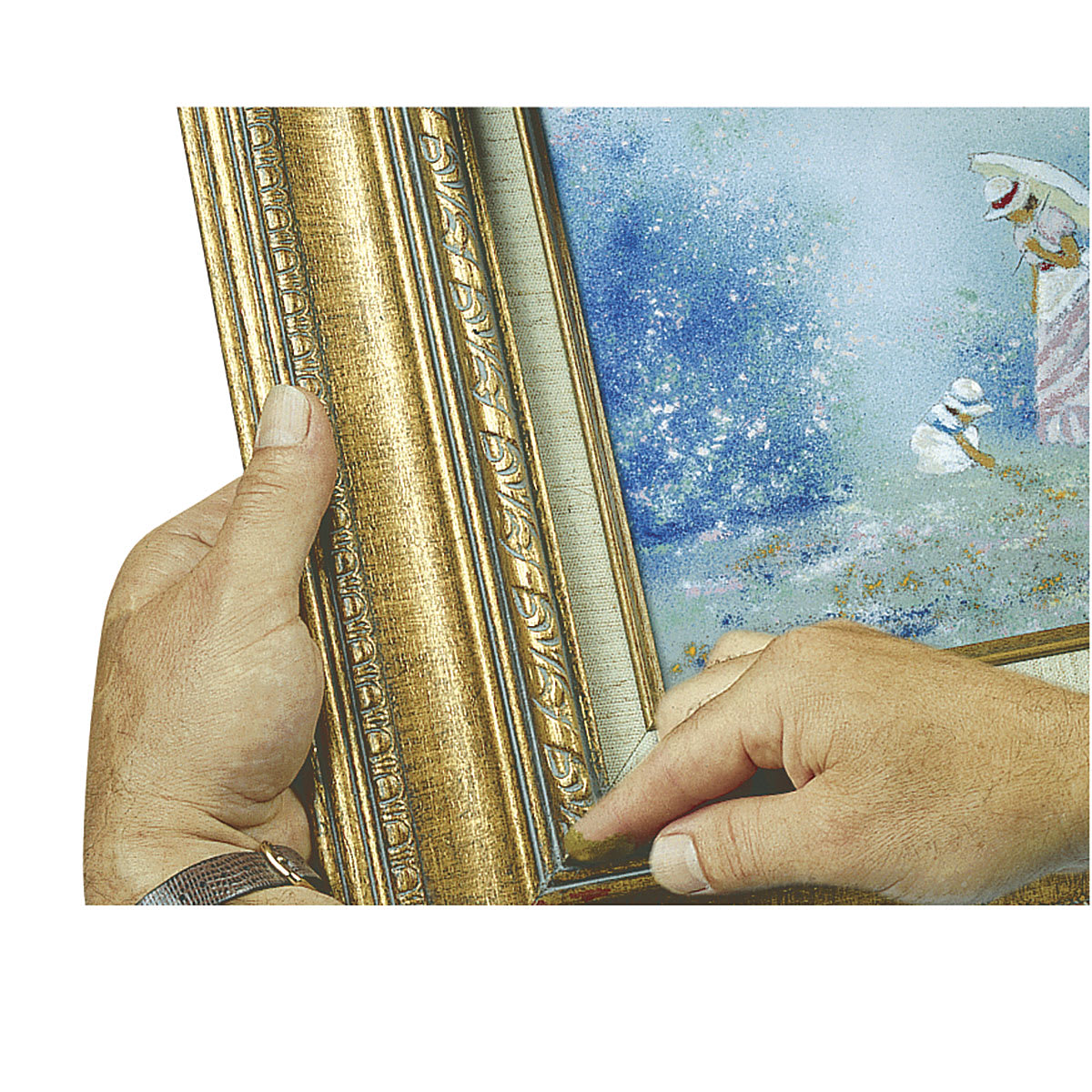 Amaco Nail Hole and Corner Filler - Closeup of hands filling small hole in frame