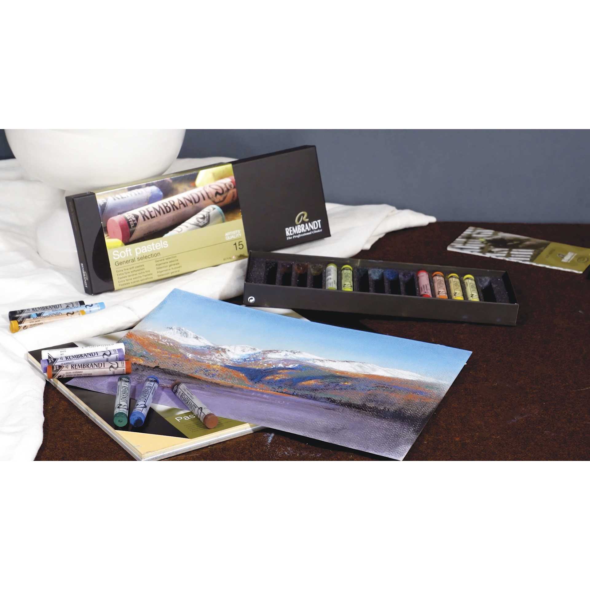 Rembrandt Soft Pastels and Sets, artwork and supplies on desk
