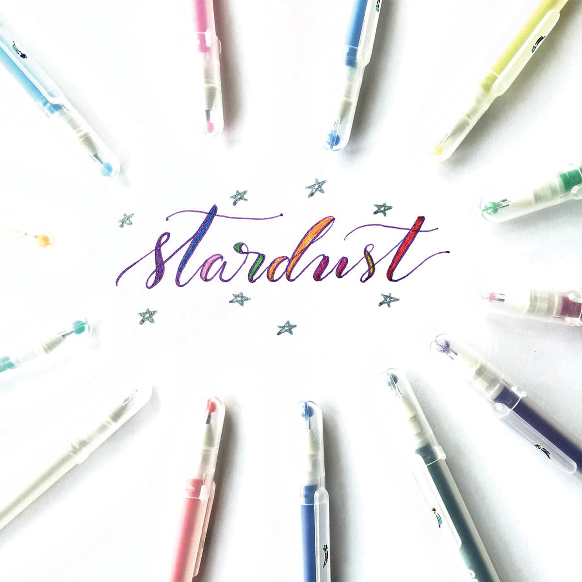 Sakura Gelly Roll Stardust Pens - All colors of pens in circle around fancy lettering