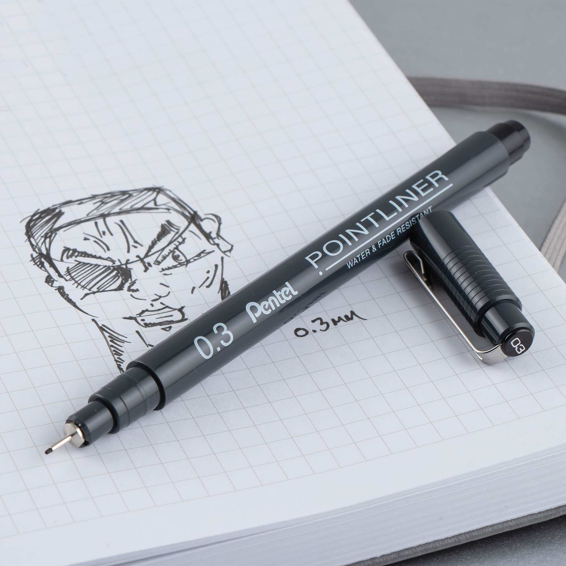Pentel Arts Pointliner Pen - Black, 0.3 mm (being used to draw a face)