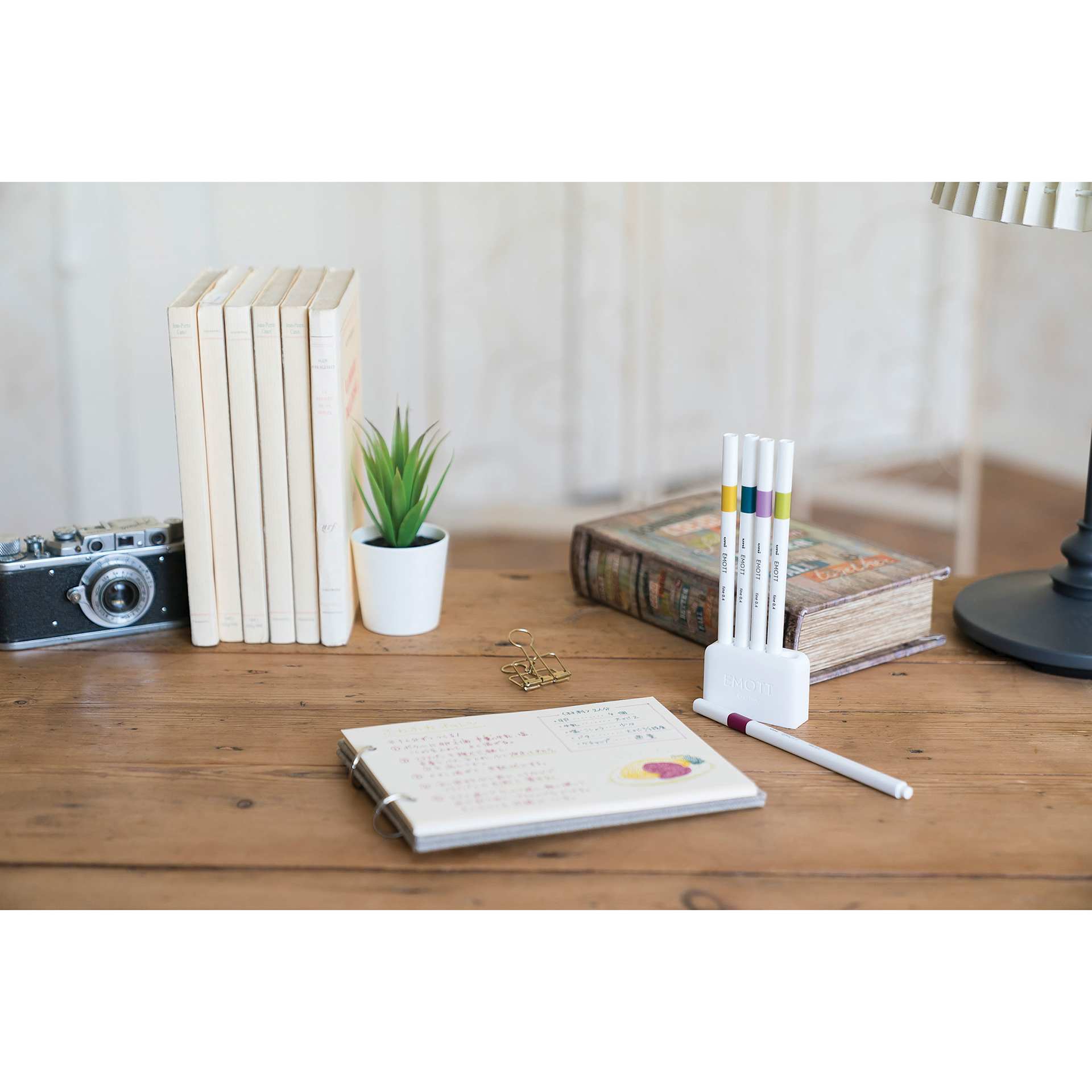 Uni Emott Fineliners - Set of 5, Retro Colors (on table with notebook)