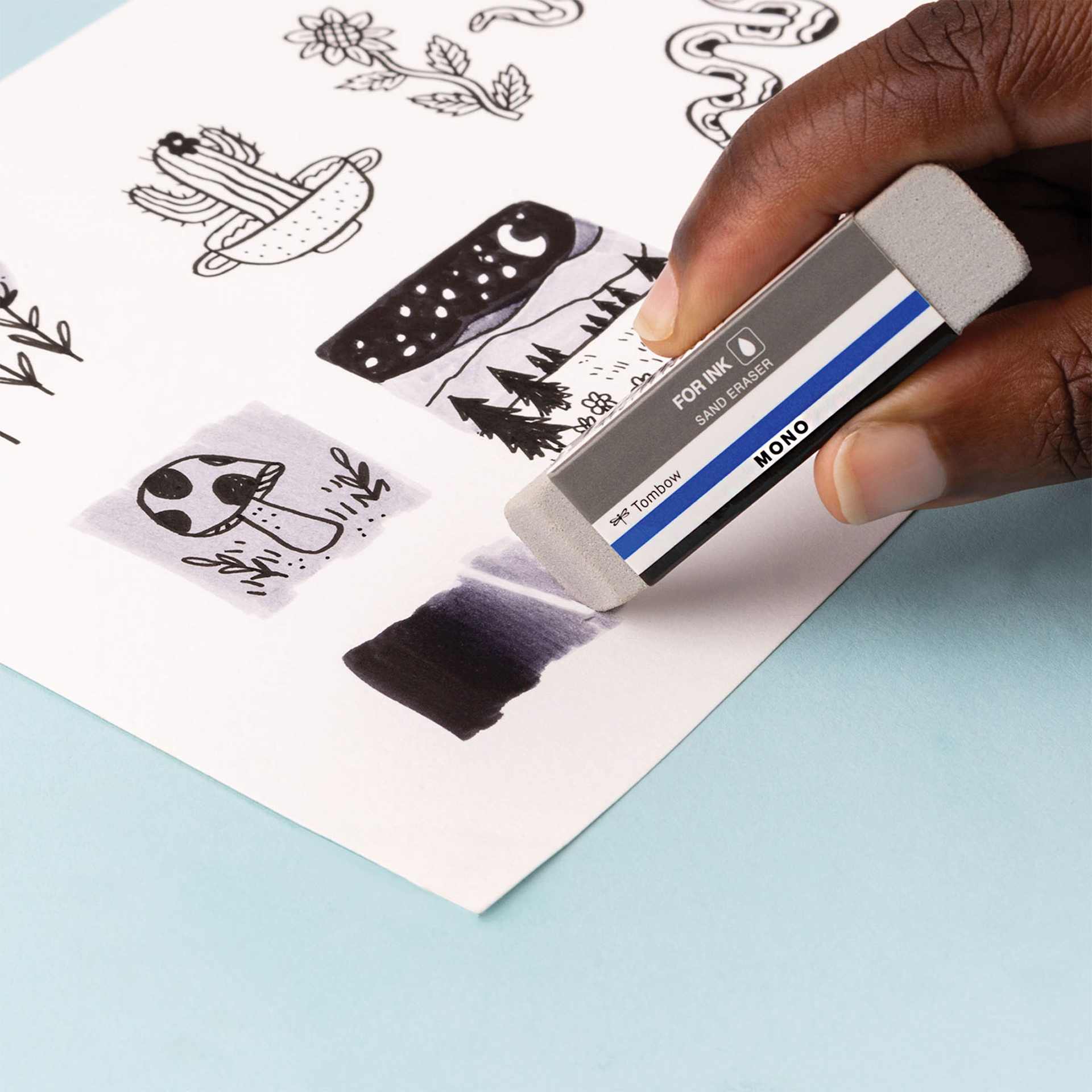 Tombow Mono Eraser Variety Pack - Set of 4, Mono Sand Eraser in hand demonstrating usage Tombow Mono Eraser Variety Pack - Set of 4, Mono Sand Eraser in hand demonstrating usage