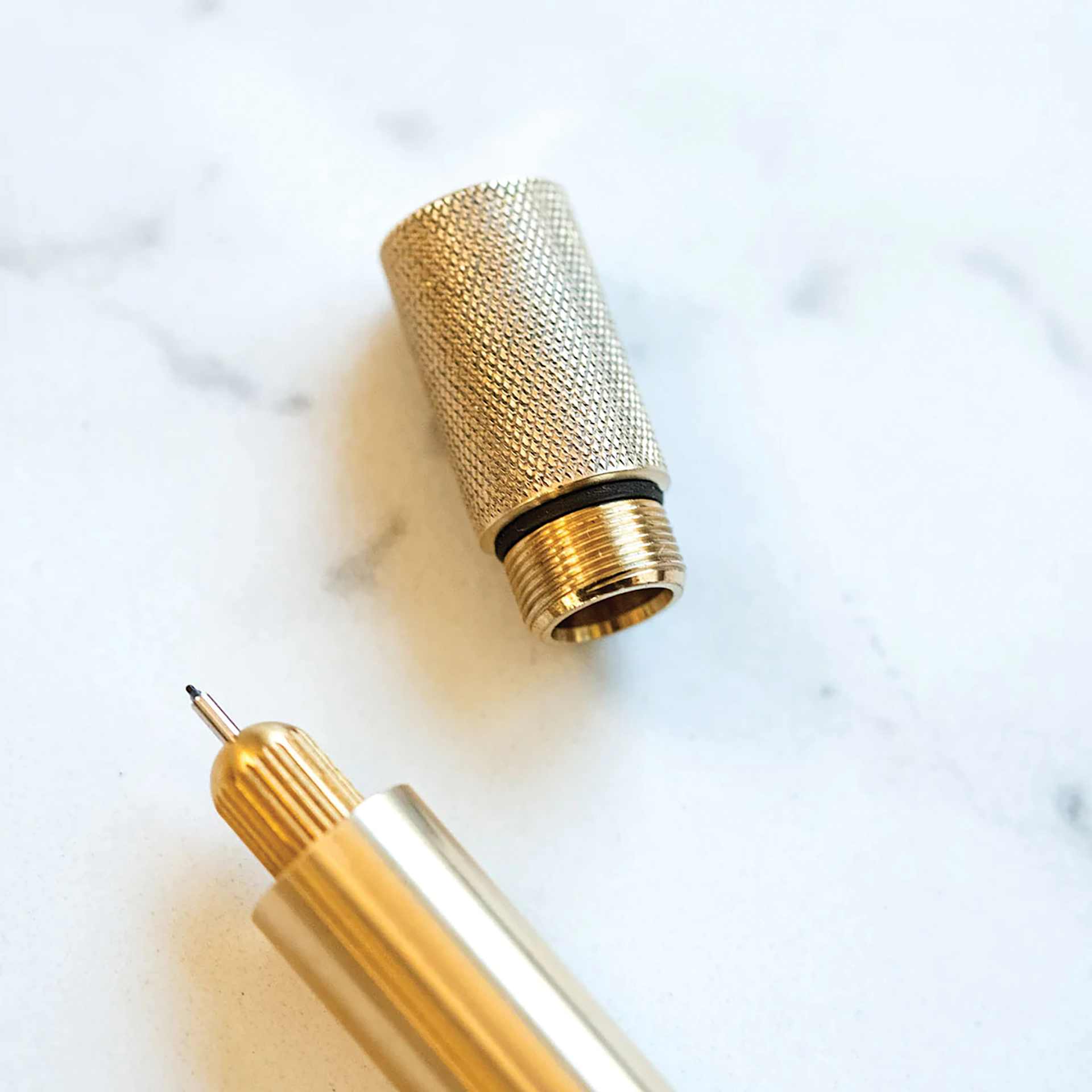 Tom's Studio Lumos Mini Refillable Pen - Solid Brass, close-up of pen and cap