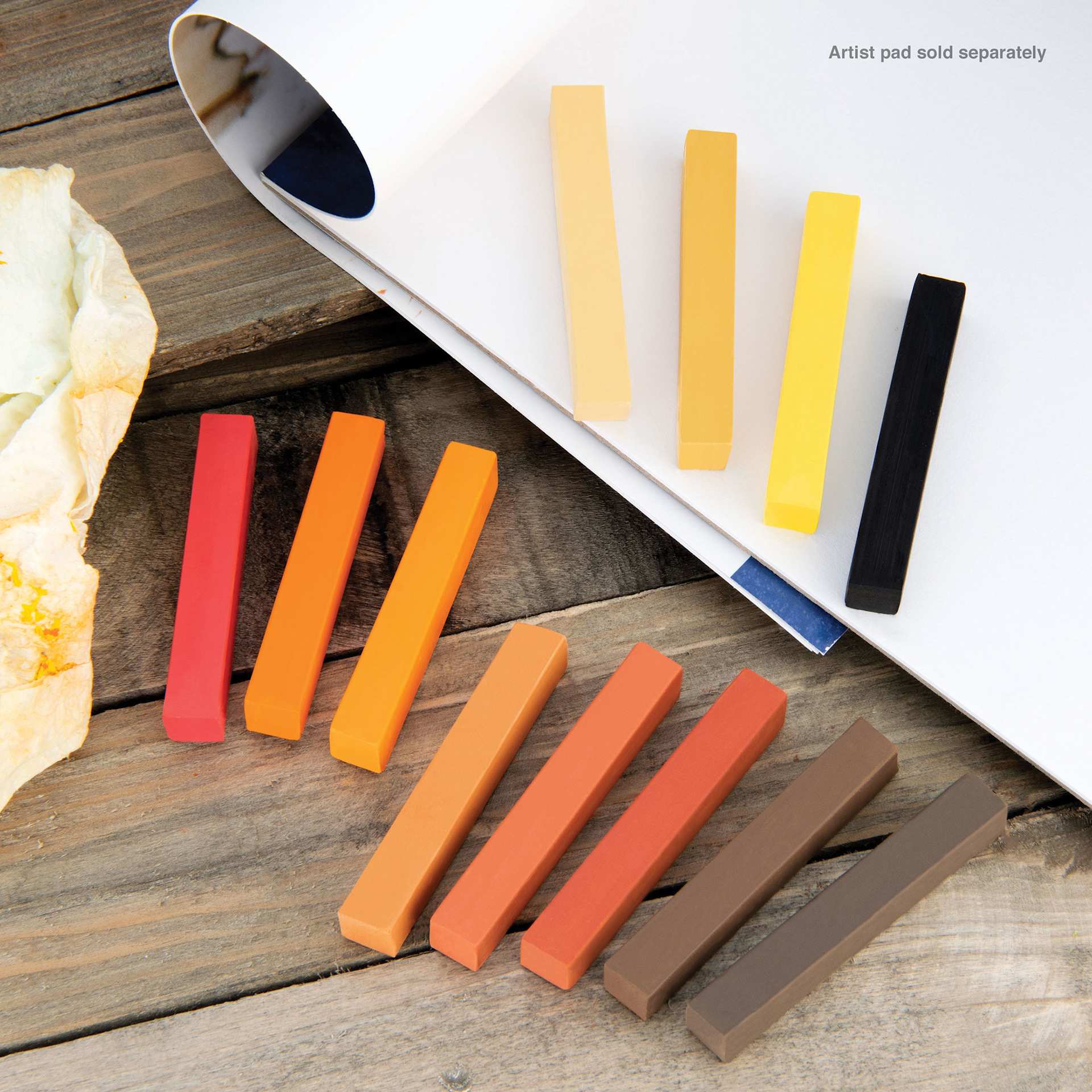 Royal & Langnickel Soft Pastel Set - Set of 12, Earth Tones, contents laying on desk and paper pad