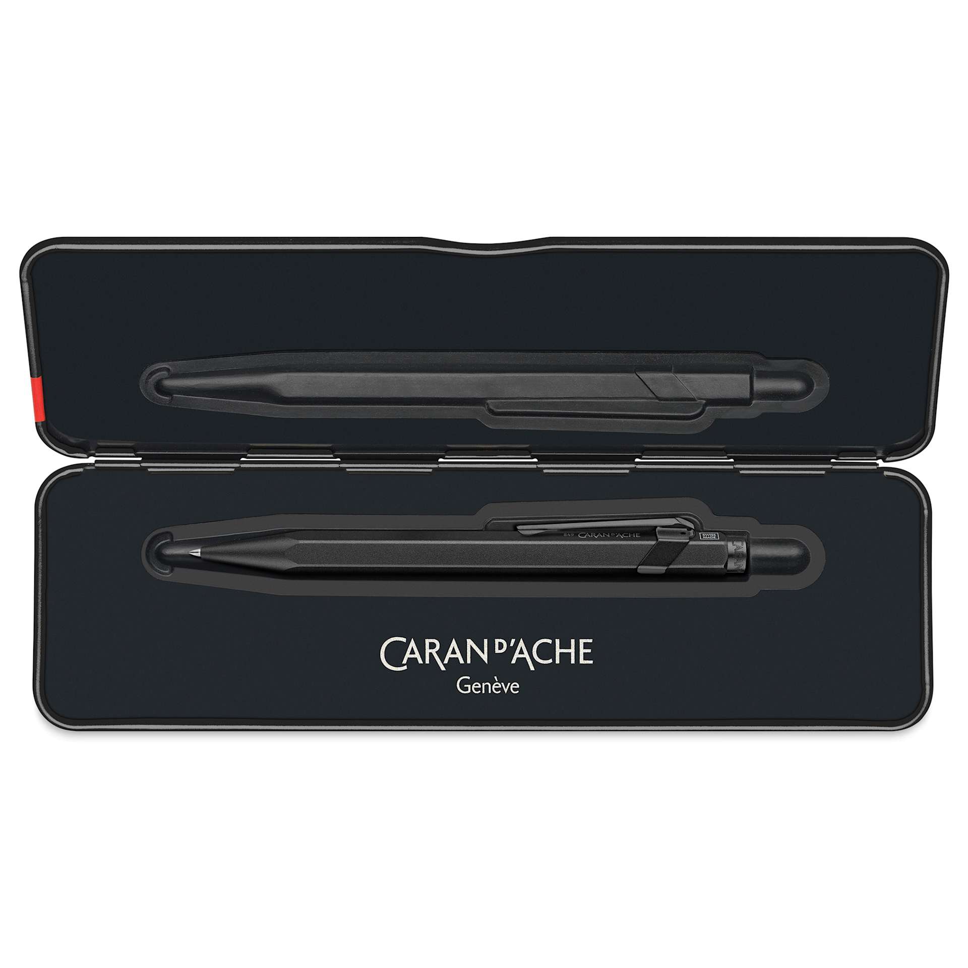Caran d'Ache 849 Black Code XL Ballpoint Pen - Black, shown inside of the metal case