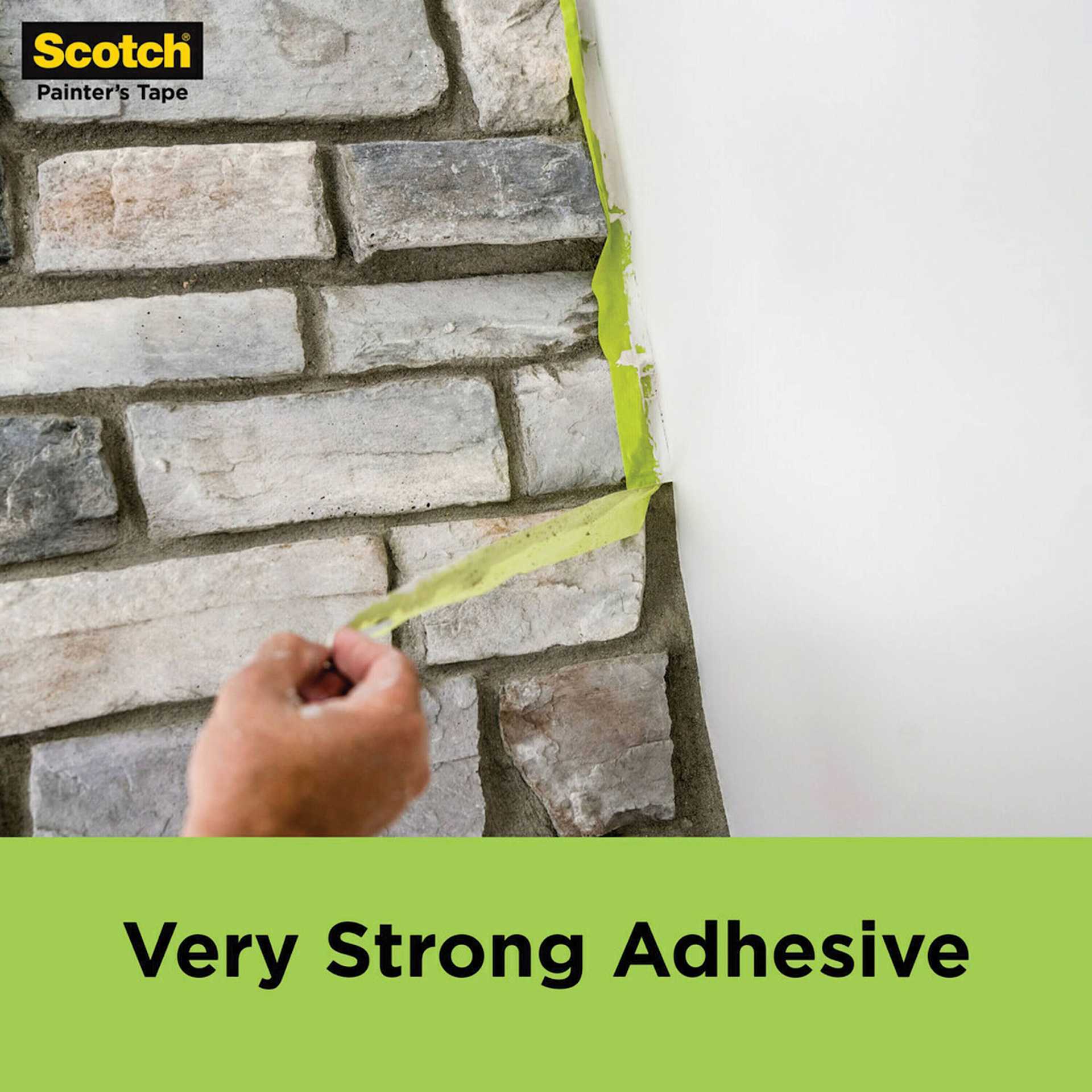 Scotch Rough Surface Painter’s Tape, tape being removed from wall