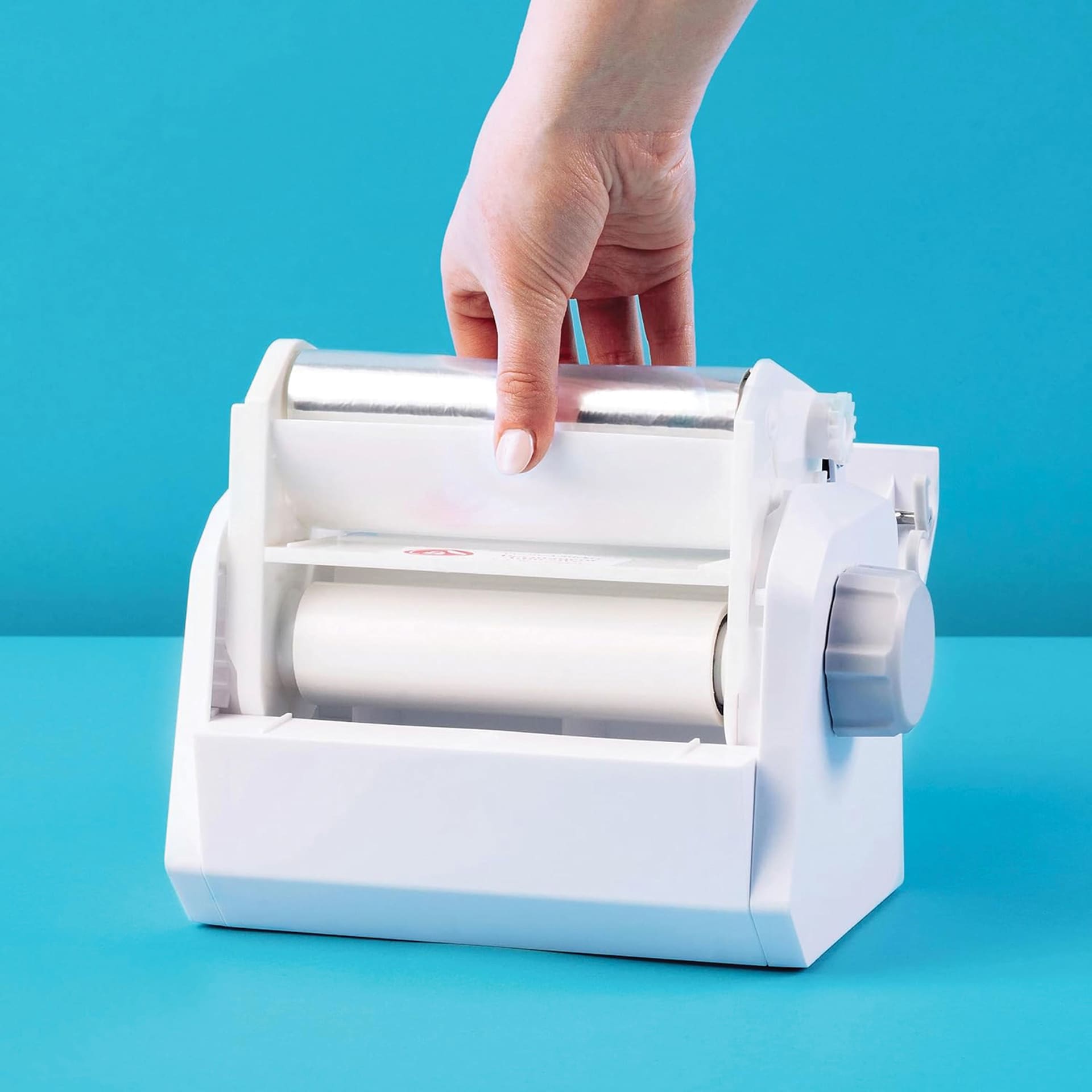 Xyron Create-A-Sticker Permanent Refill Cartridge being placed in Xyron Create-A-Sticker Sticker Maker (sold separately)