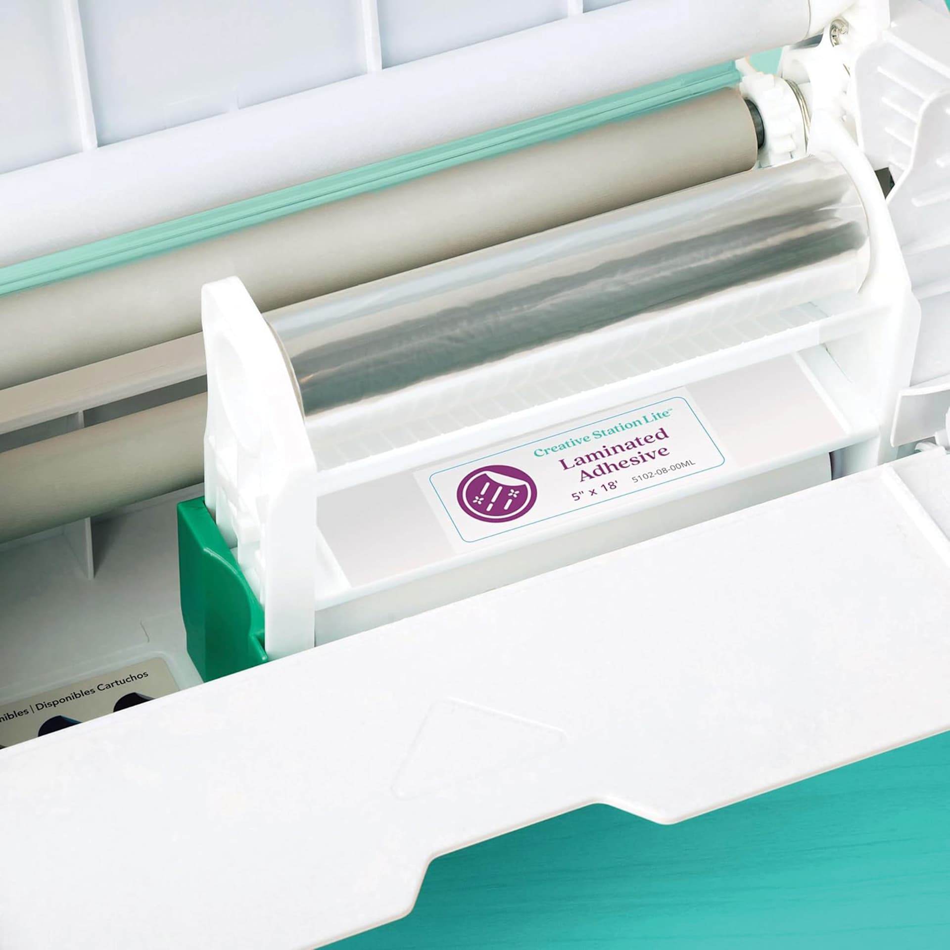 Xyron Creative Station Lite Laminated Adhesive Refill Cartridge close up while insdie laminator