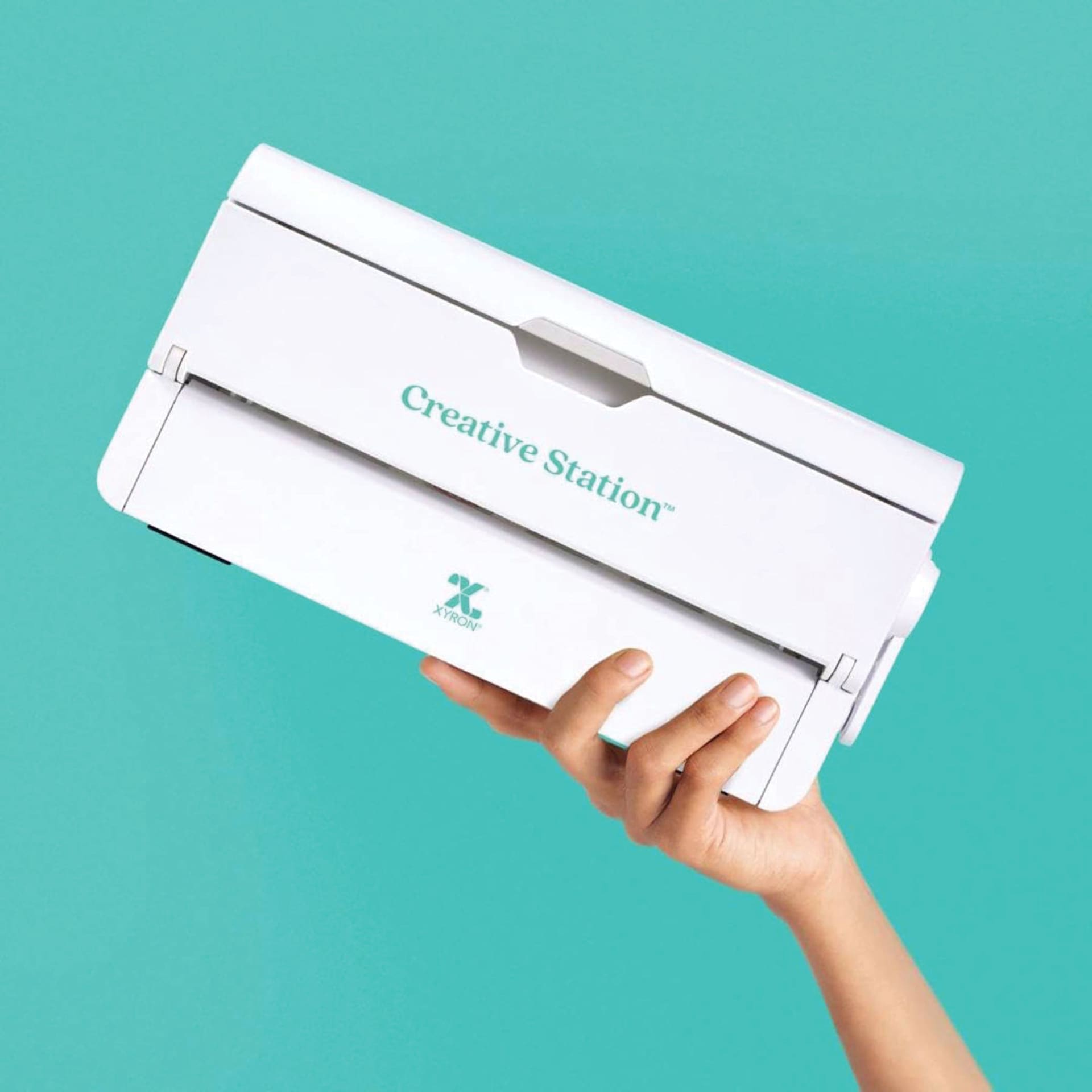 Xyron 900 Creative Station Laminator being held