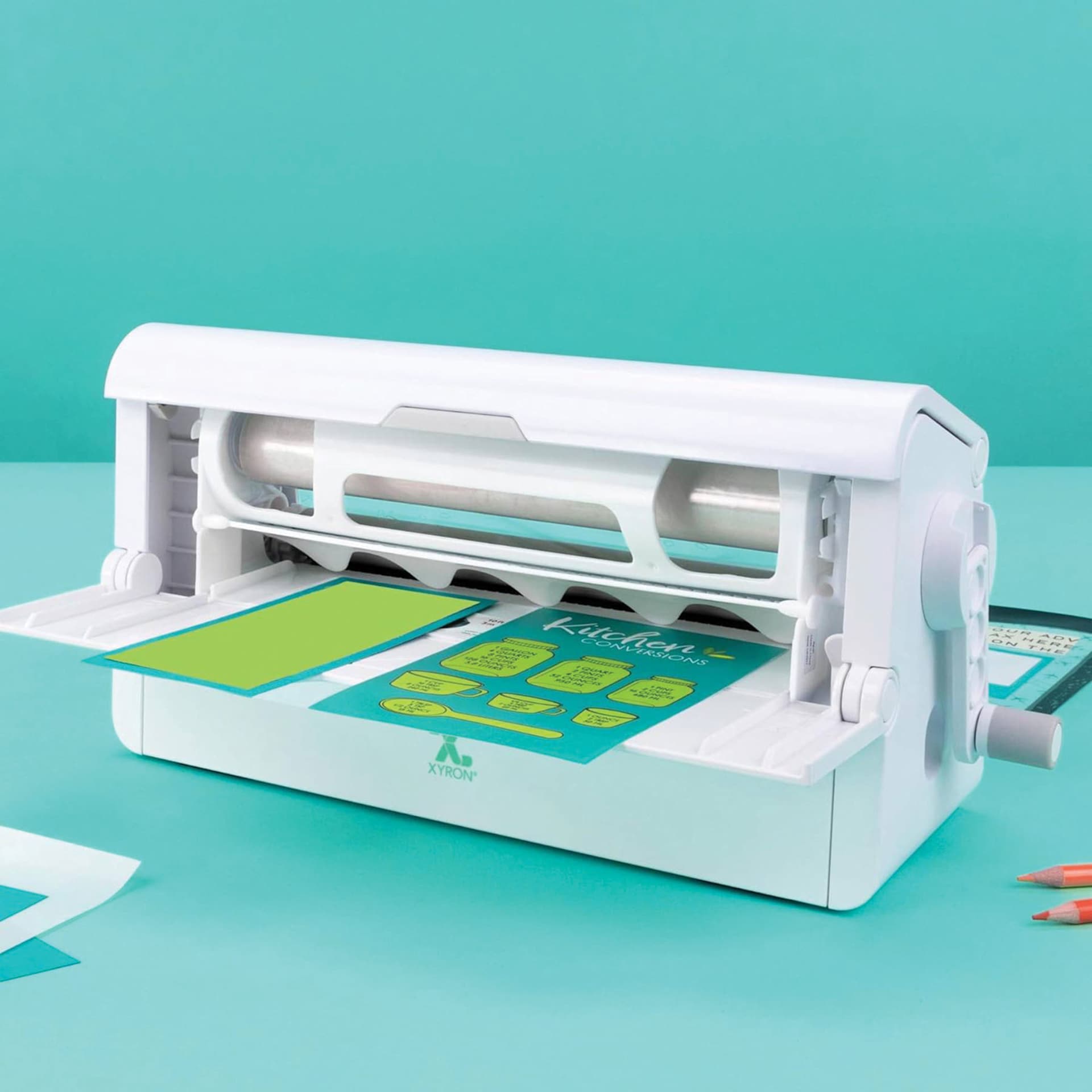 Xyron 900 Creative Station Laminator laminating paper from back view
