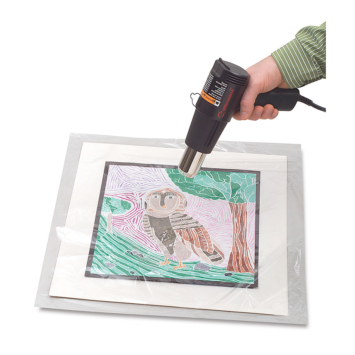 Mountex Shrink Film being shrunk with heat gun.