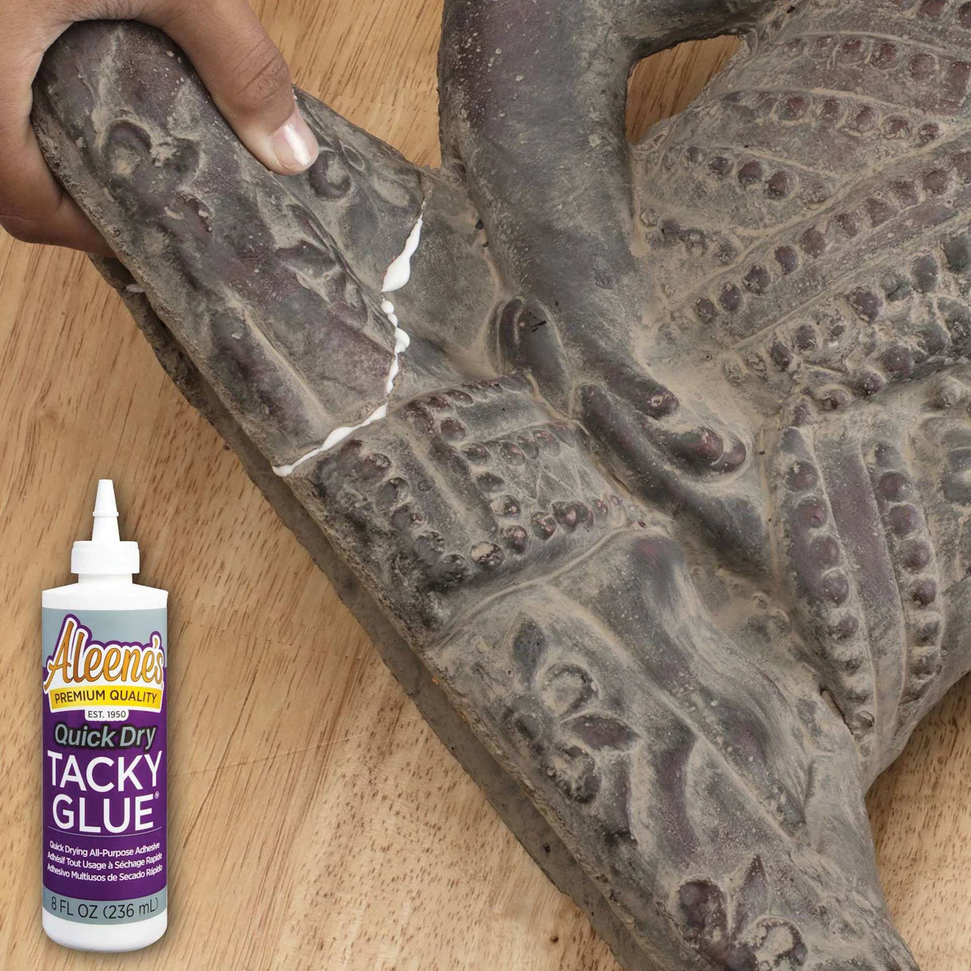Aleene's Quick Dry Tacky Glue - 8 oz Bottle being used to repair sculpture