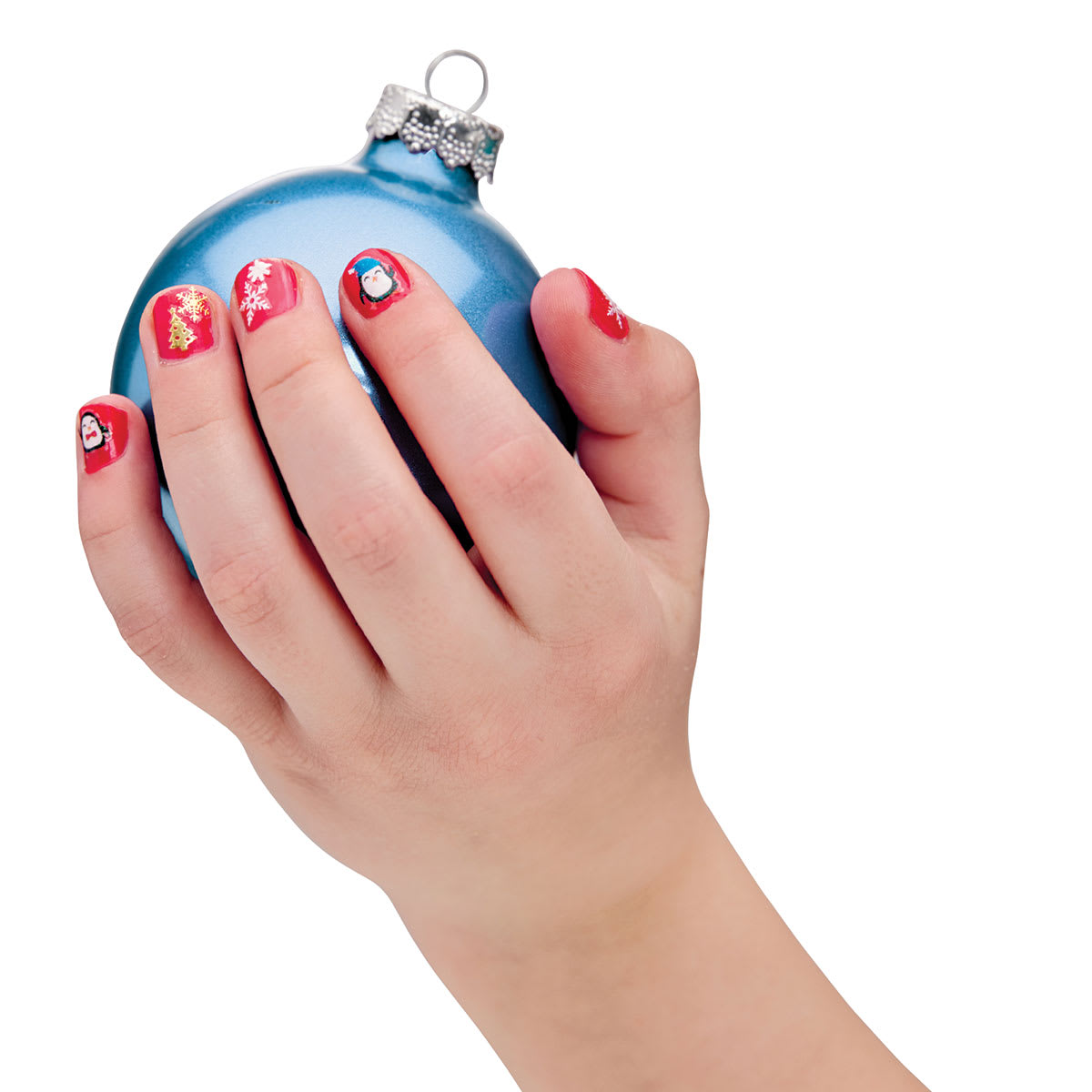 Holiday Nail Art Mini Kit - Child's hand with Stickers on nails holding blue tree ornament