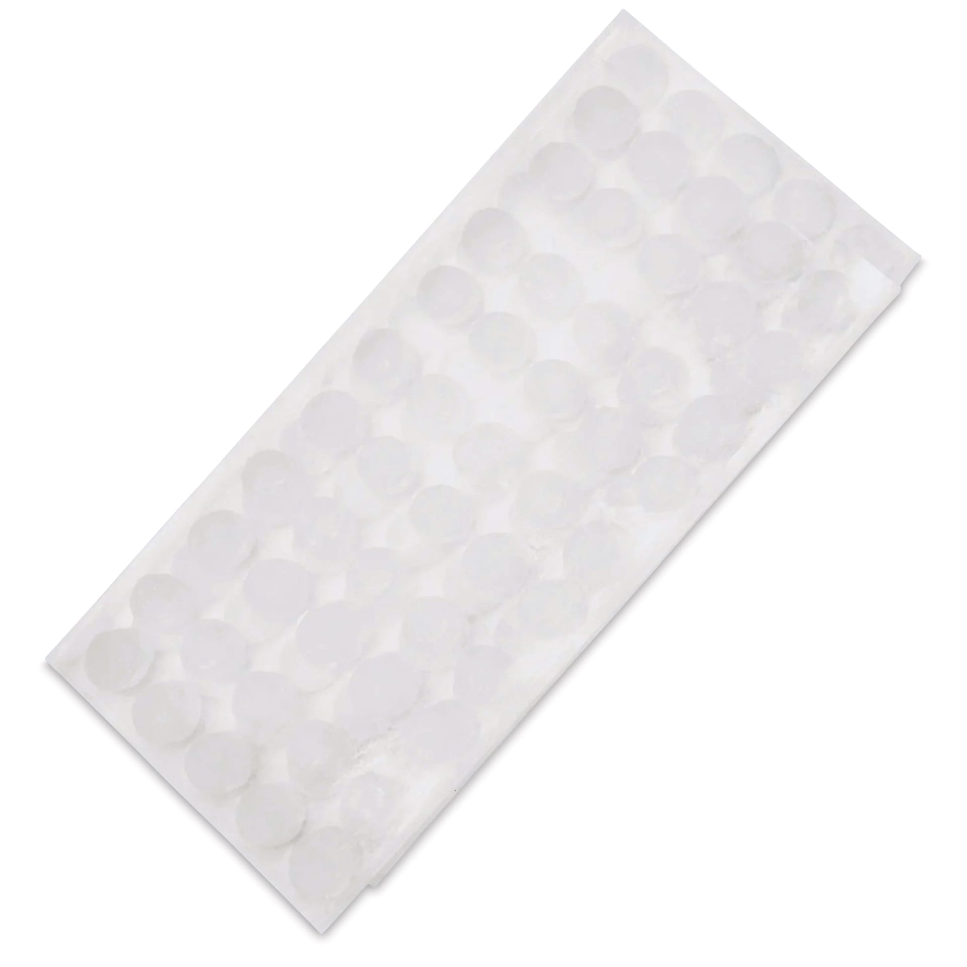 StikkiWorks StikkiDots Adhesive Wax Dots, angled view of Dots on sheet