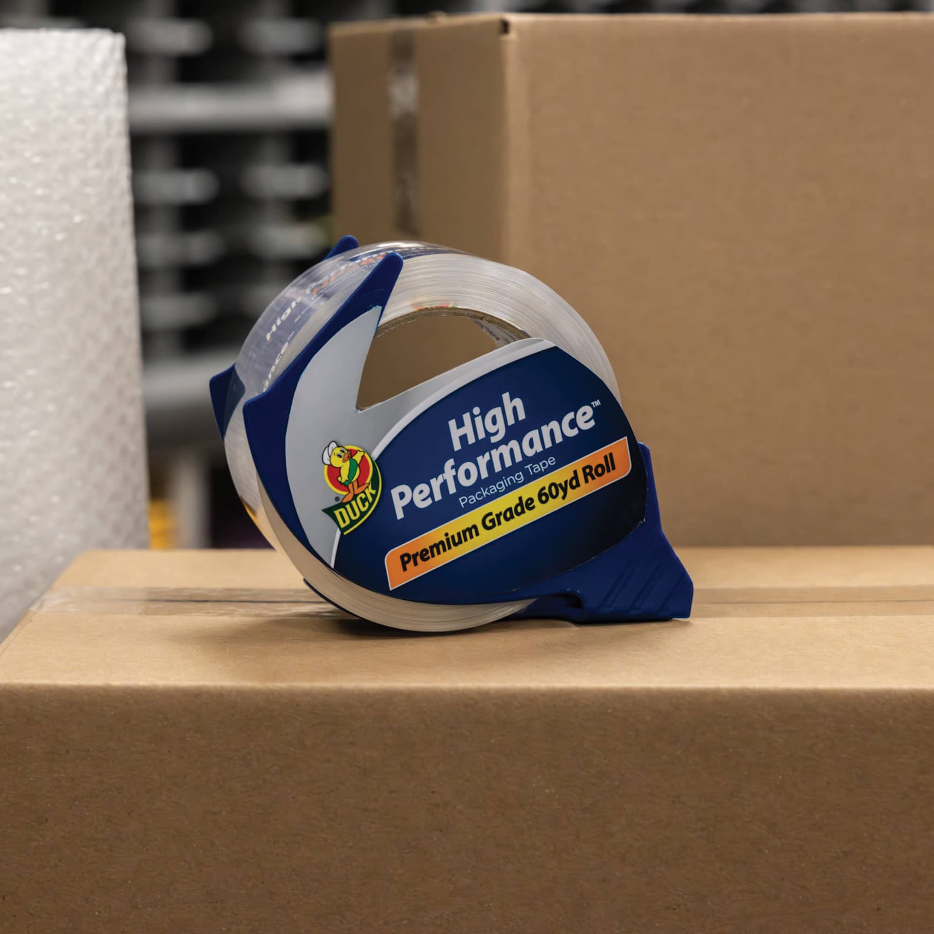 Duck HP260 High Performance Premium Packing Tape - 1.88" x 60 yds, with Dispenser - on cardboard box