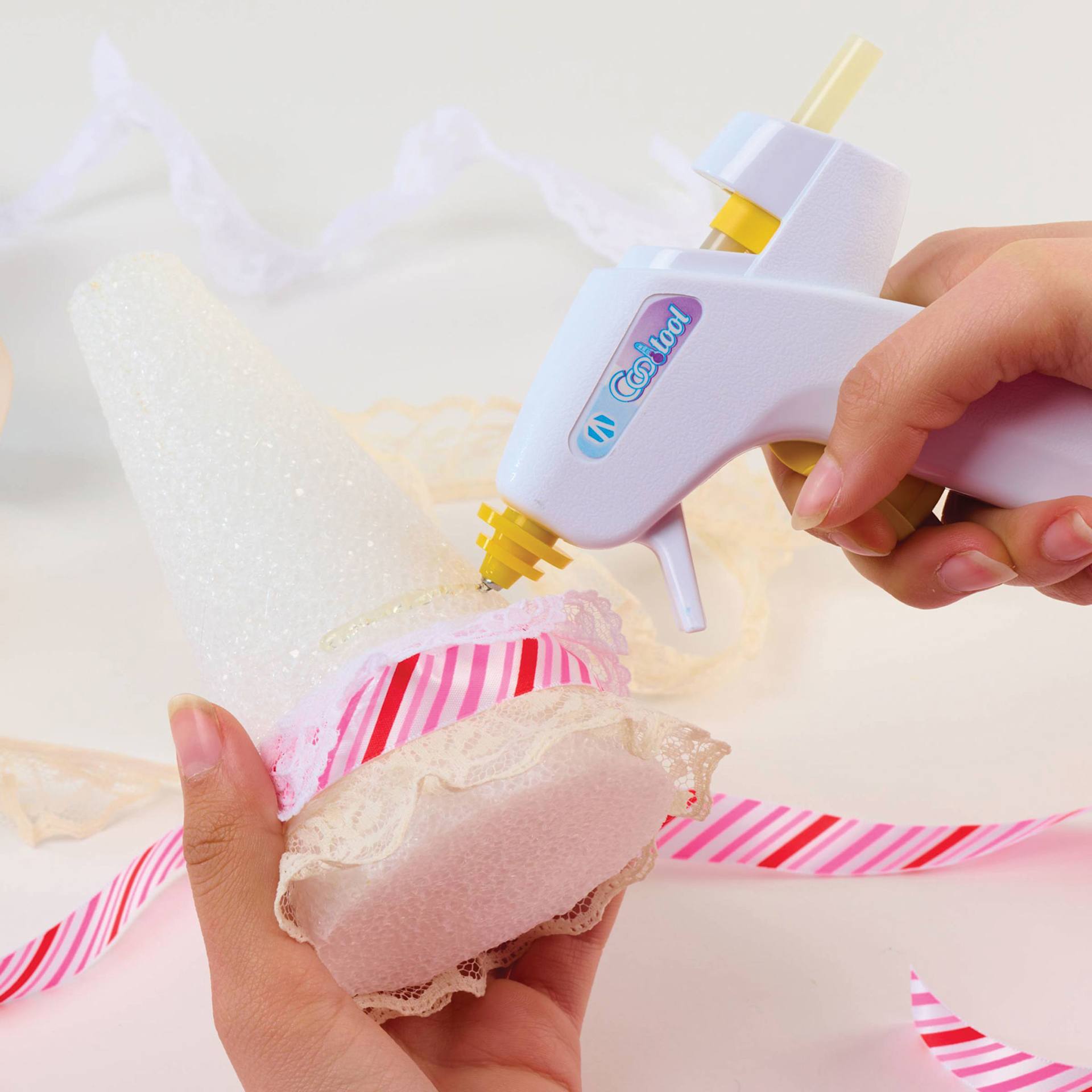 AdTech Cool Tool Super Low Temp Mini Glue Gun, fabric being glued