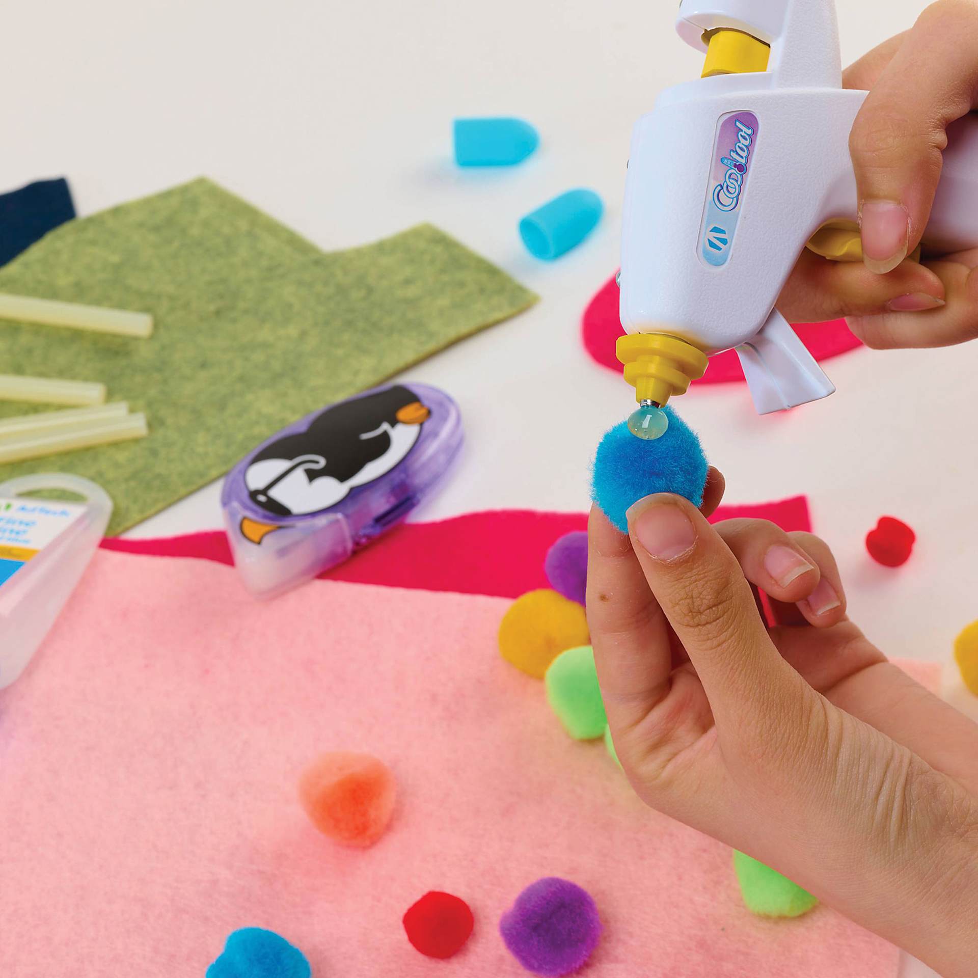 AdTech Cool Tool Super Low Temp Mini Glue Gun, pom poms being glued