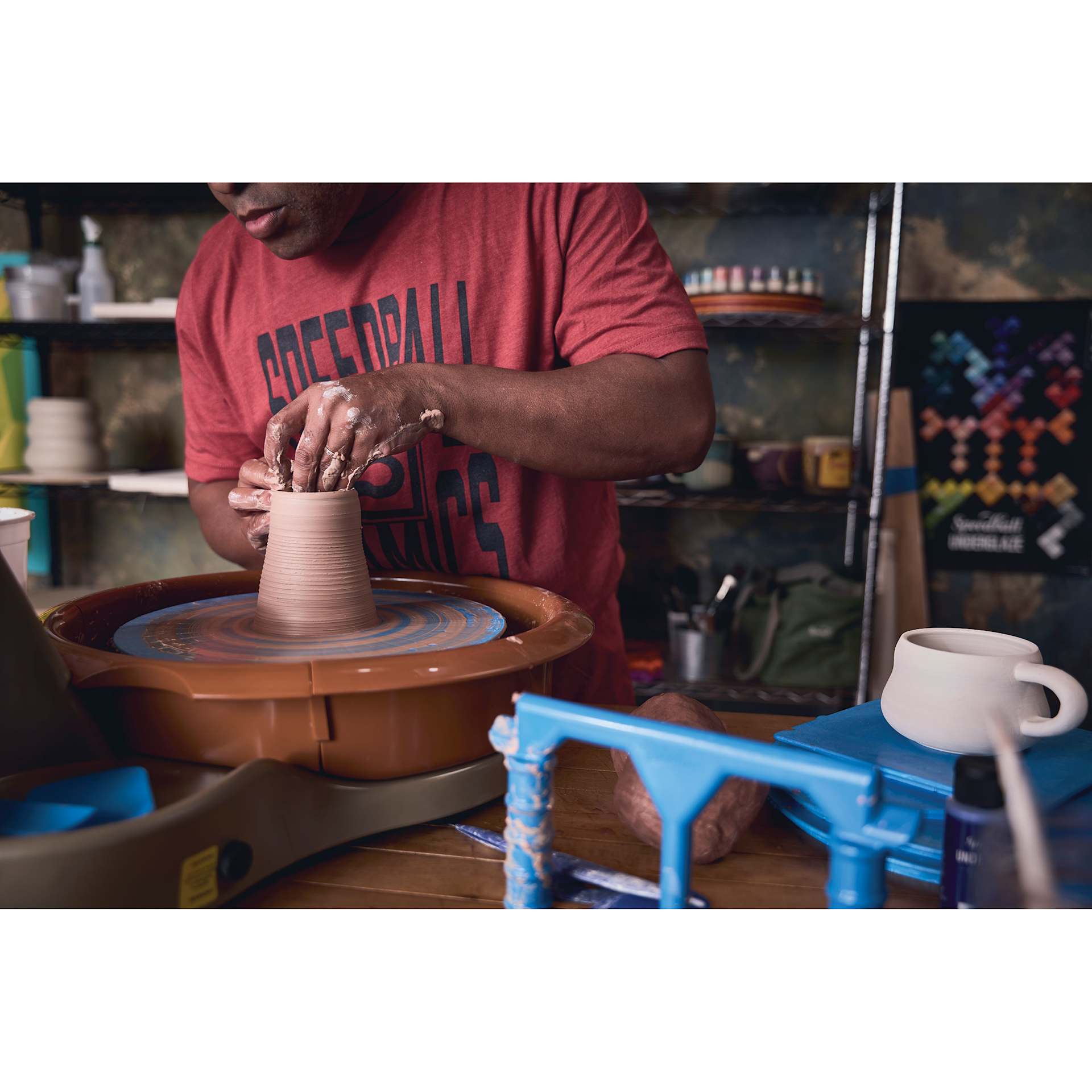 Speedball Artista Potter's Wheel being used to form vessel