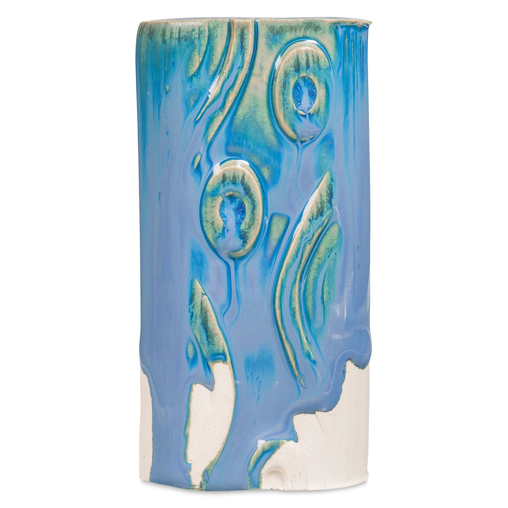 Amaco Potter's Choice Glaze - Lapis Flow on a vessel with surface decoration, fired to a Cone 6.