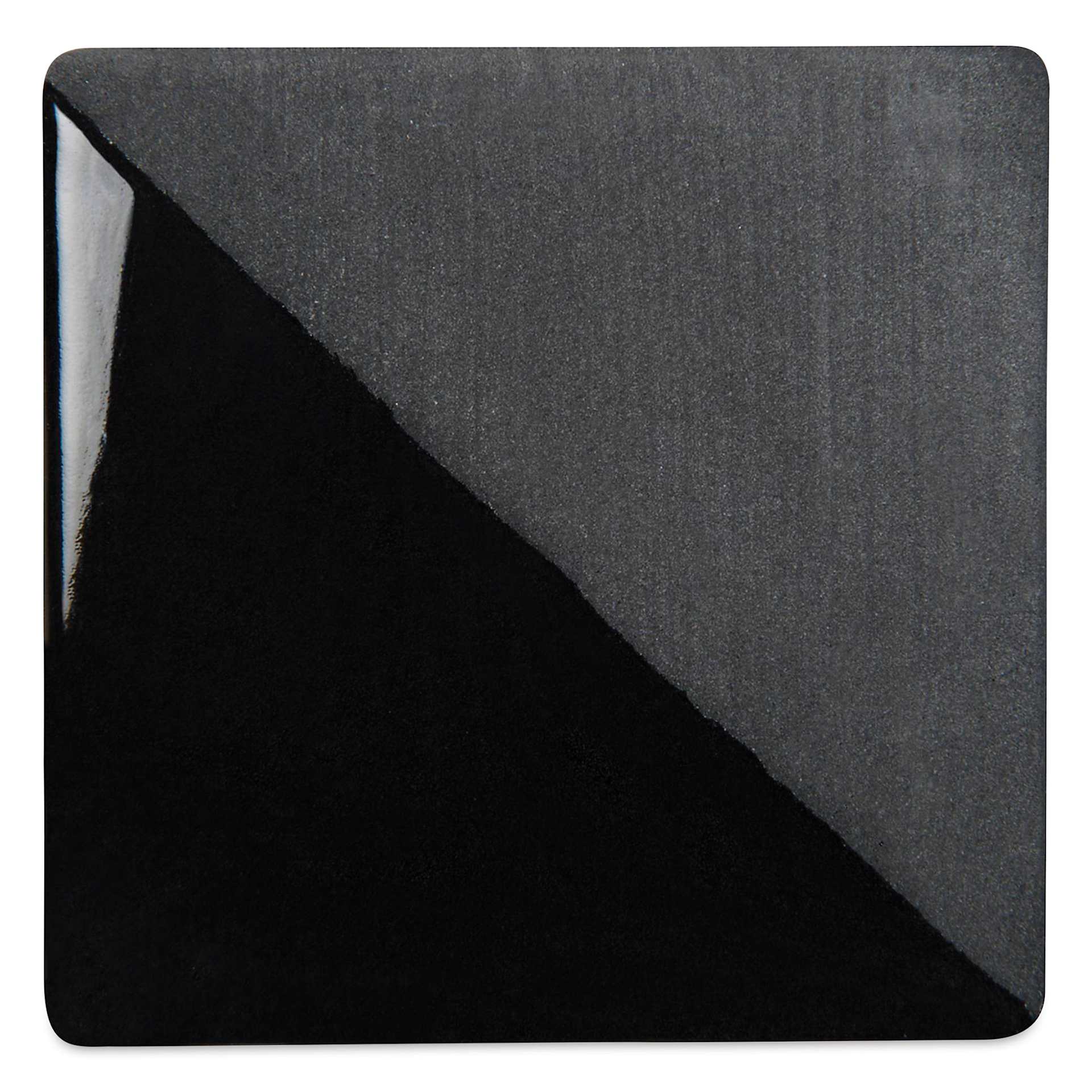 Speedball Ceramic Underglaze - Black, Opaque, fired on white clay bisque tiles, half covered in Speedball Clear Glaze, fired to cone 05