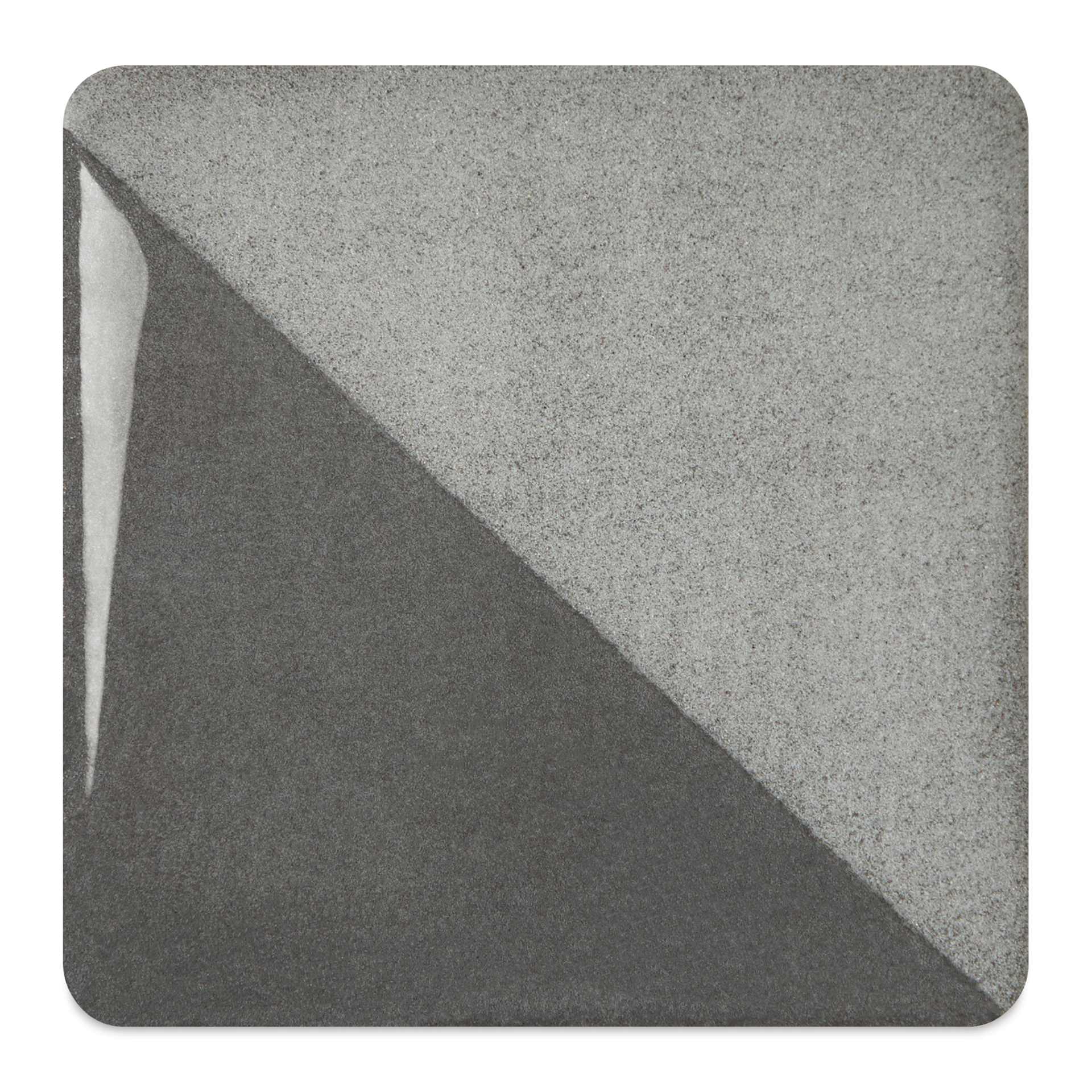 Speedball Ceramic Underglaze - Charcoal, fired on white clay bisque tiles, half covered in Speedball Clear Glaze, fired to cone 05