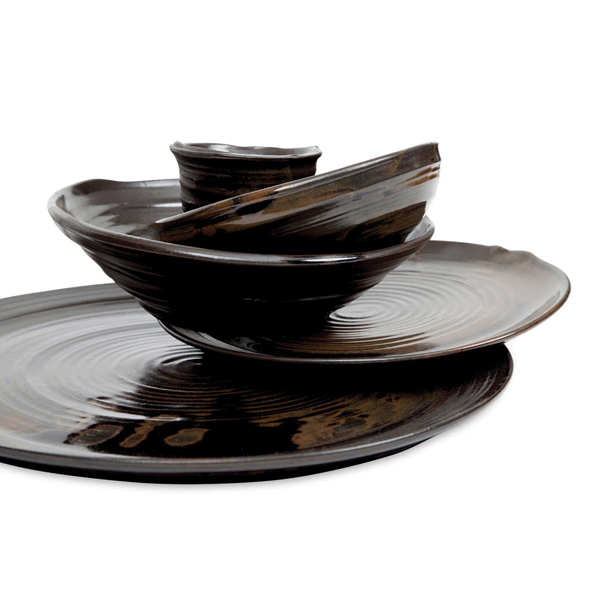 Stack of finished dishware made with Sio-2 PRNI Black Stoneware Clay