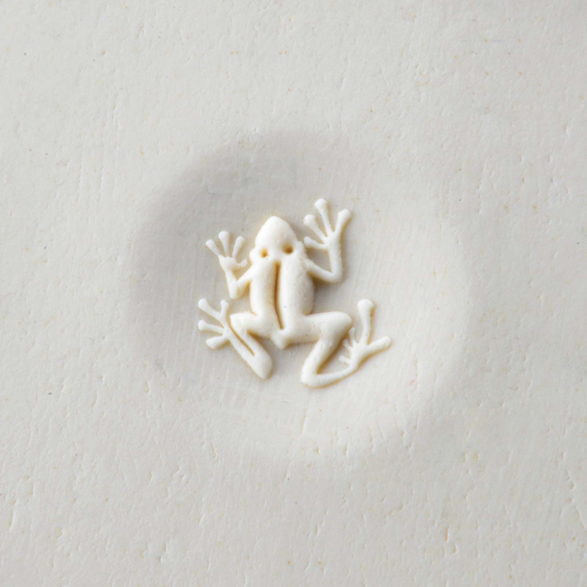 MKM Pottery Tools Curve Top Stamp - Frog, stamped into clay