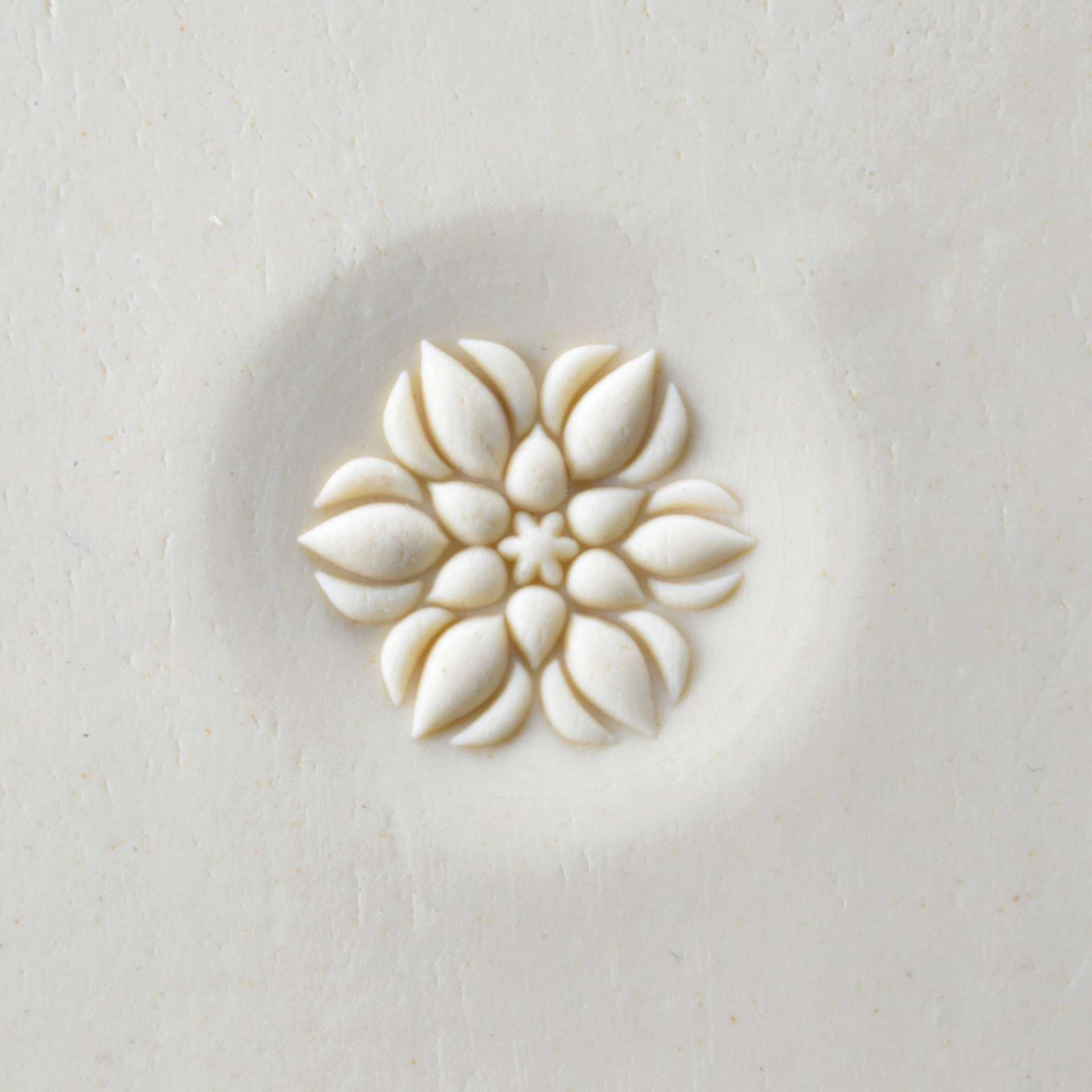MKM Pottery Tools Curve Top Stamp - Lotus Buds, stamped into clay