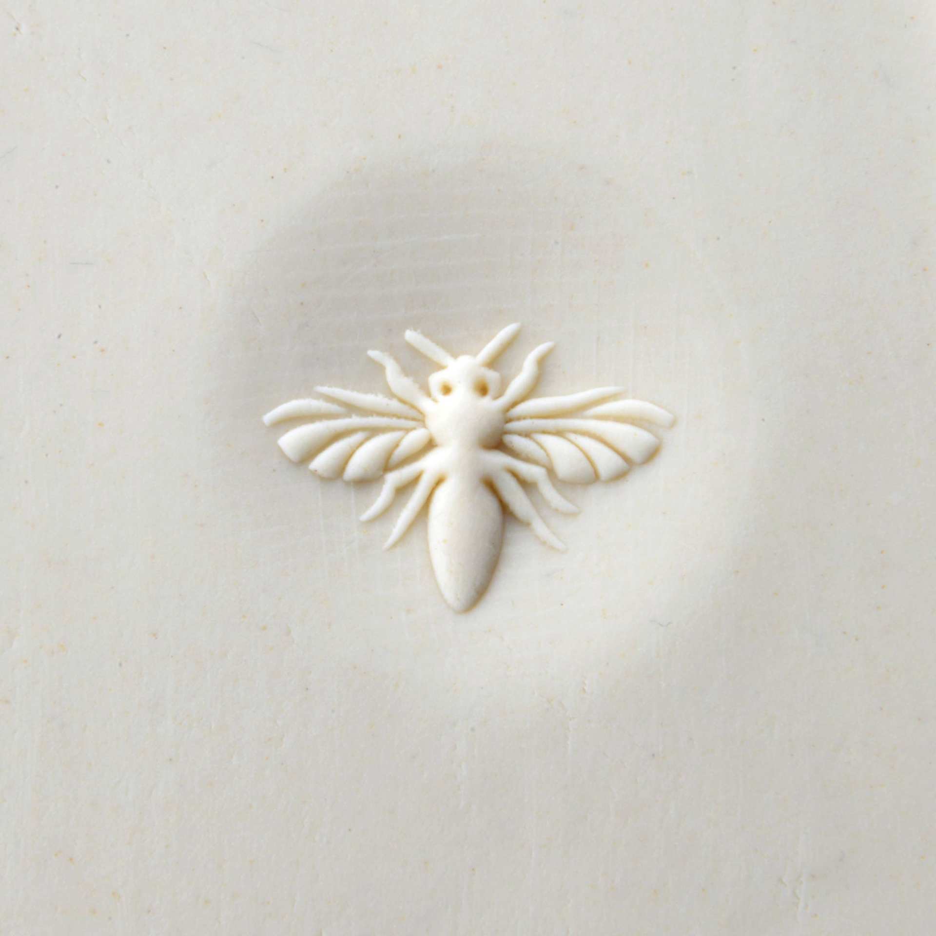 MKM Pottery Tools Curve Top Stamp - Bee - stamped into clay