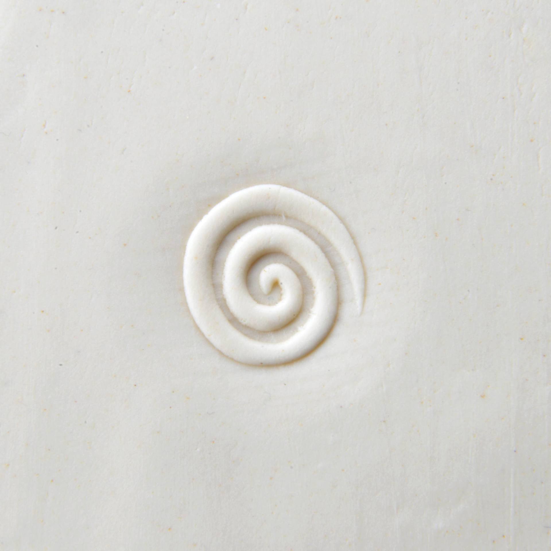 MKM Pottery Tools Curve Top Stamp - Spiral - stamped into clay