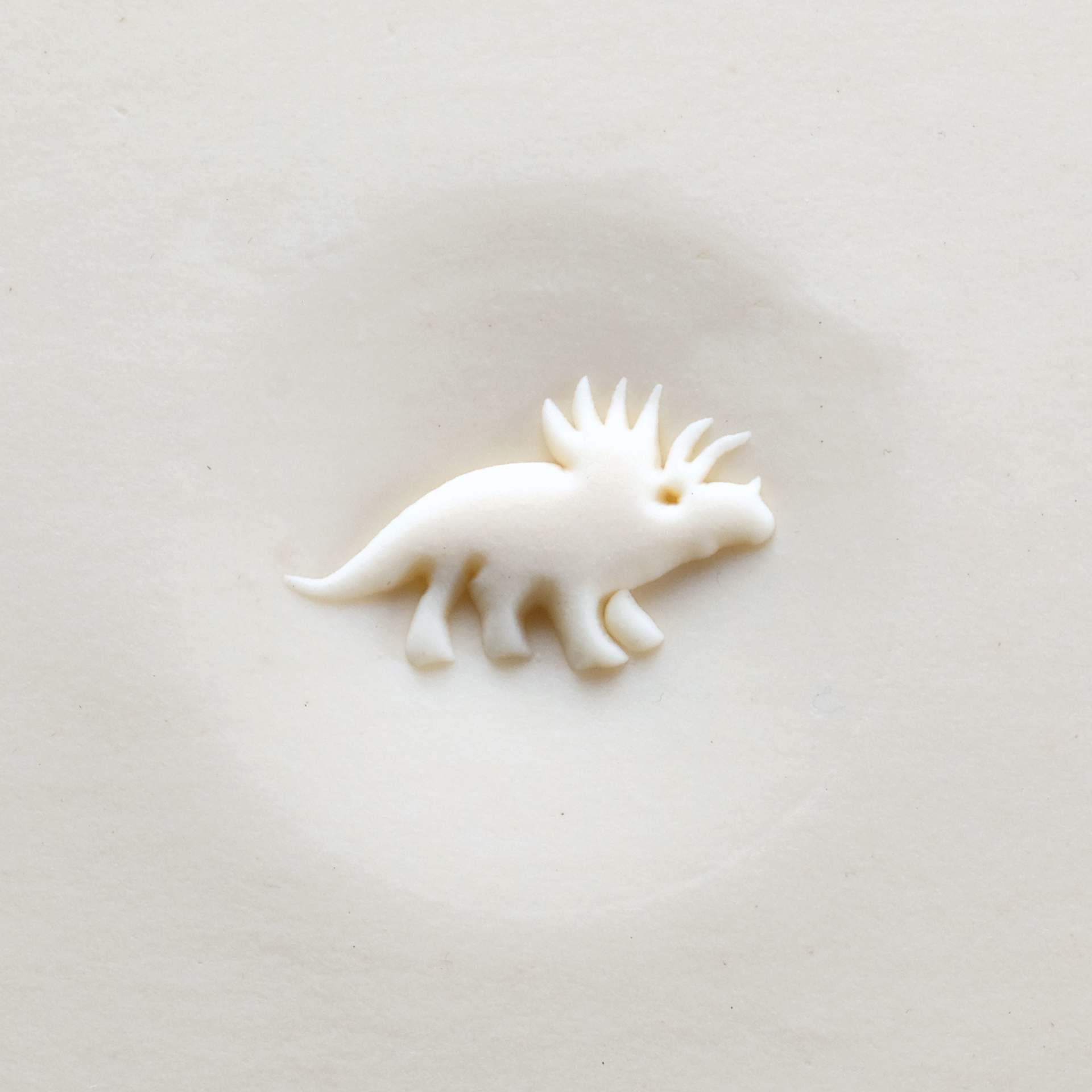 MKM Pottery Tools Curve Top Stamp - Triceratops applied to clay